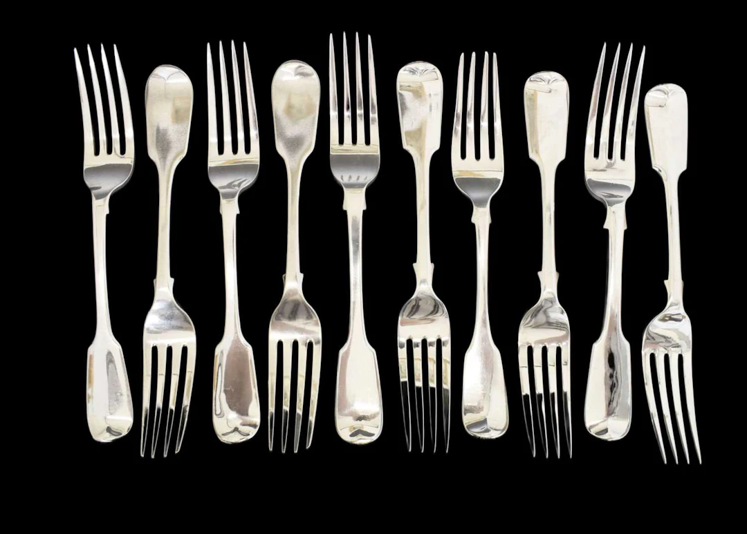 Matched set of ten silver Fiddle pattern table forks