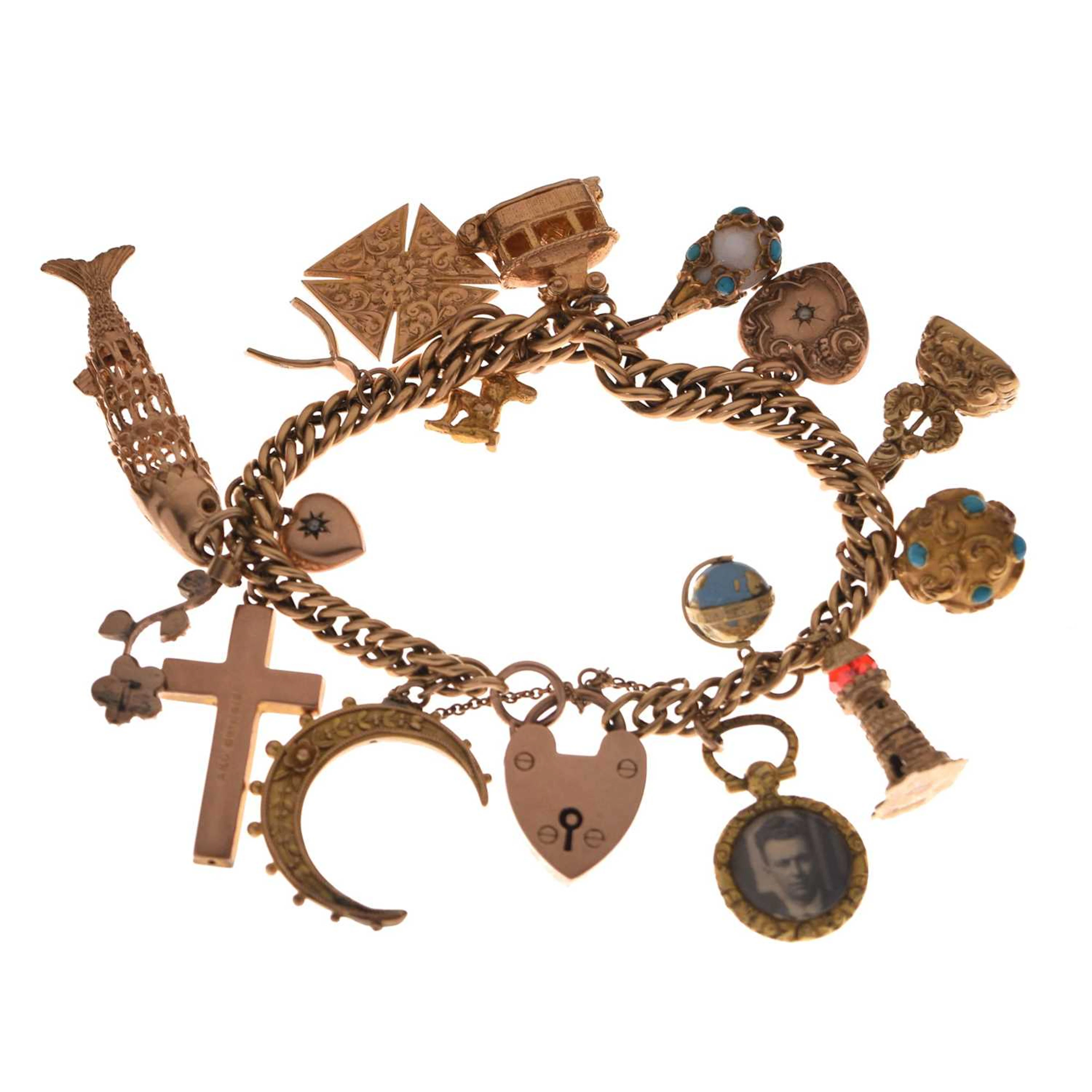 Yellow metal curb link bracelet attached various charms