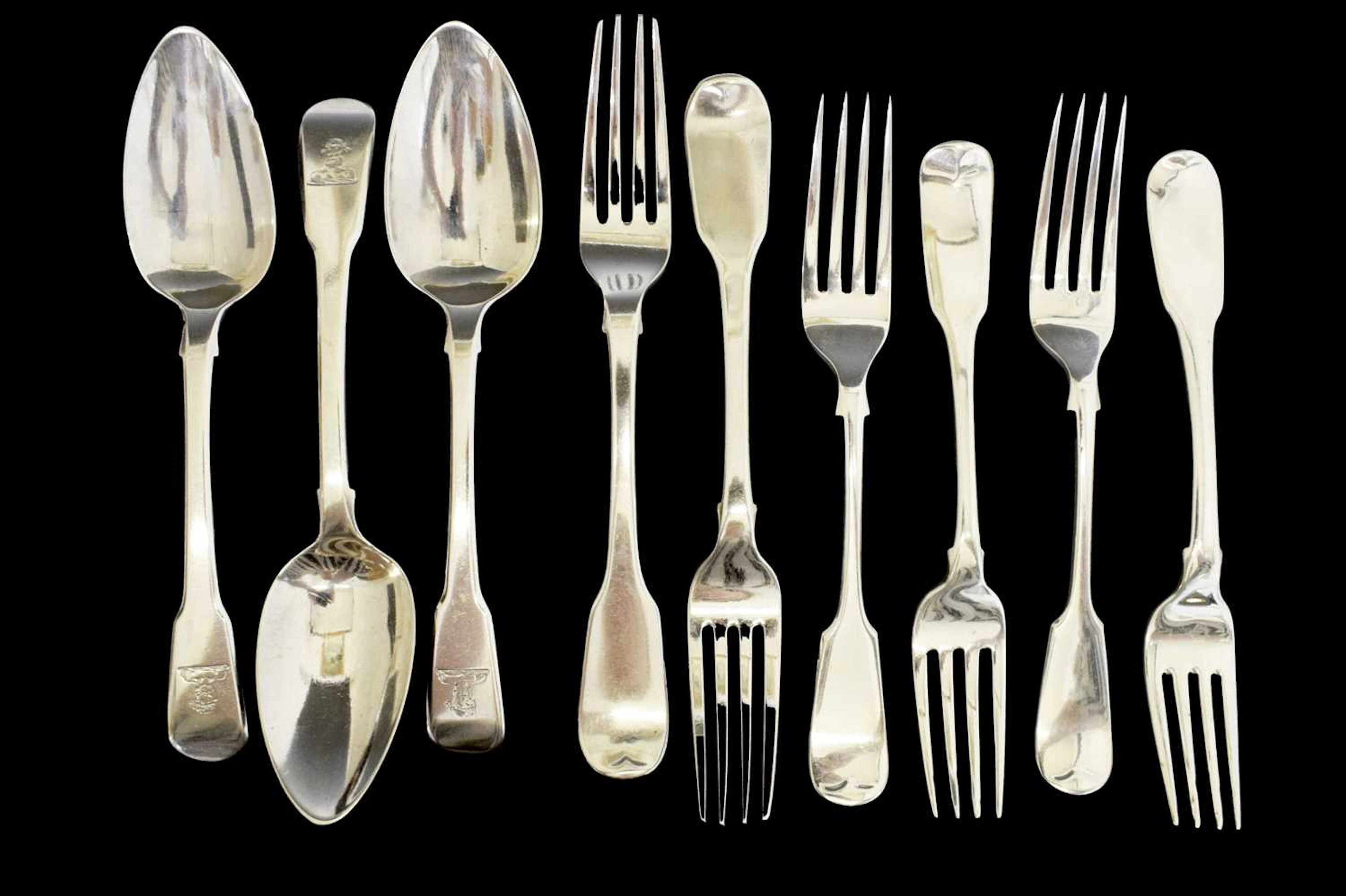 Collection of Fiddle pattern dessert forks and dessert spoons