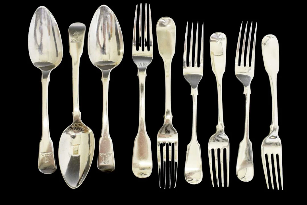 Collection of Fiddle pattern dessert forks and dessert spoons
