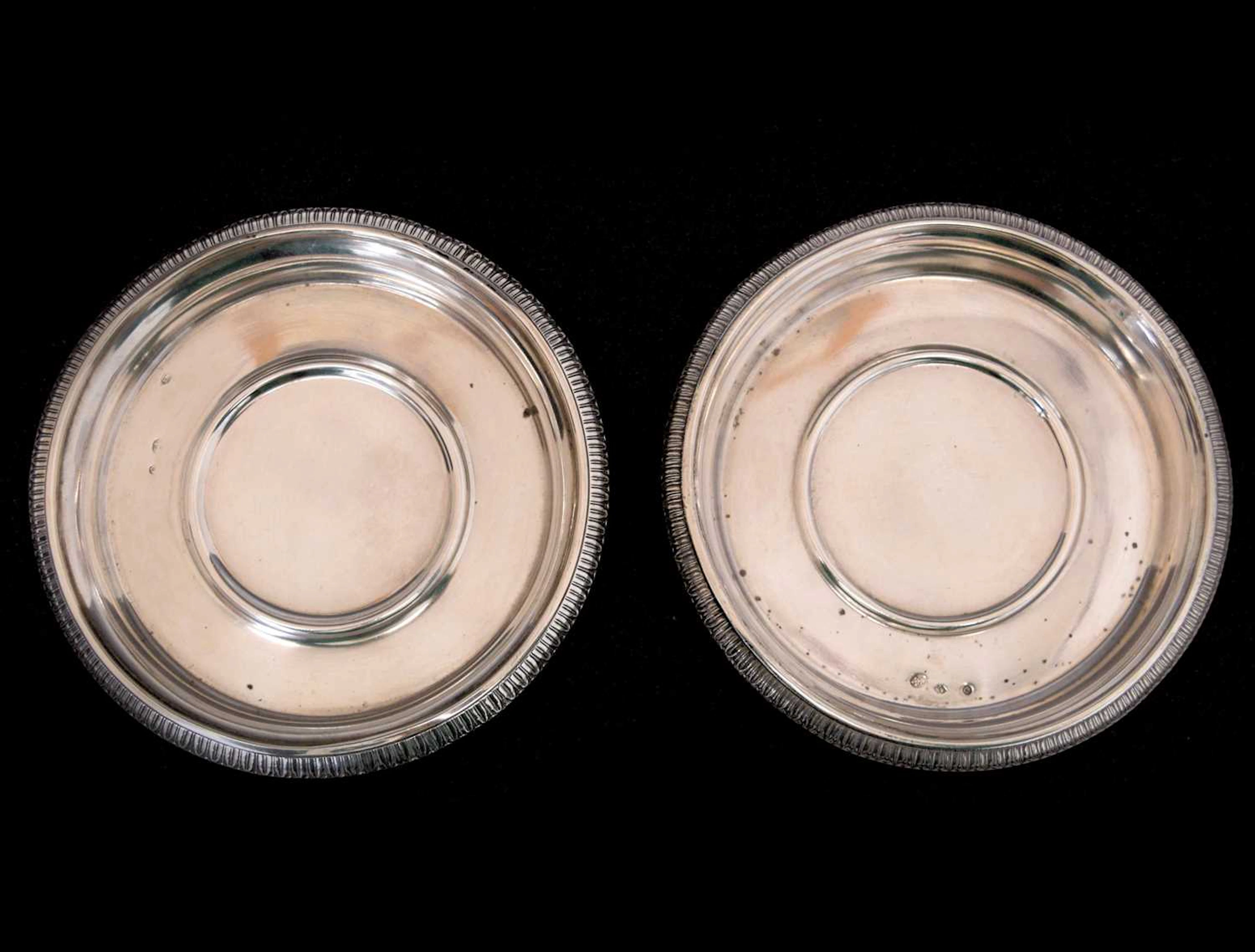 Pair of Continental white metal coasters