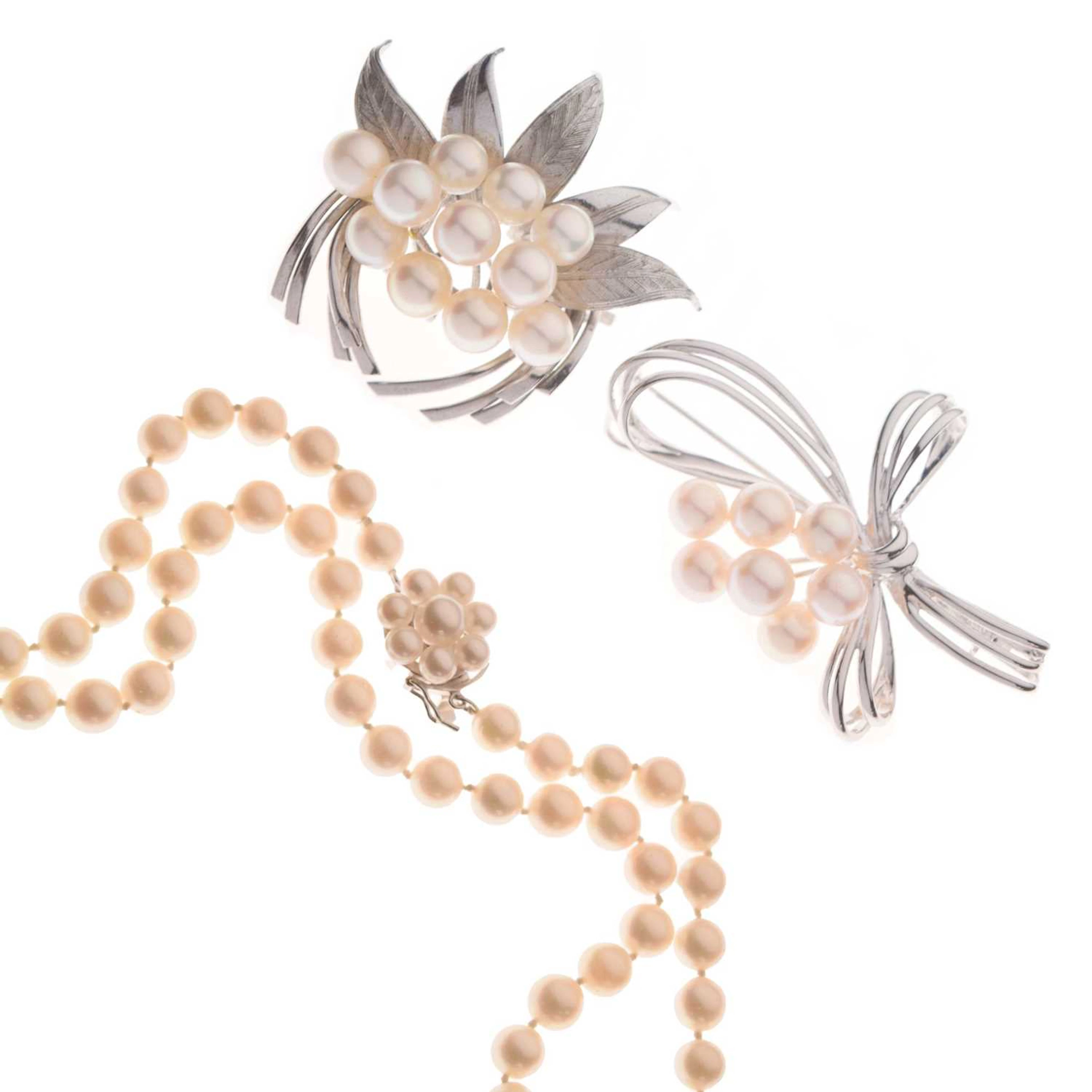 Tasaki cultured pearl necklace and two silver brooches (3)