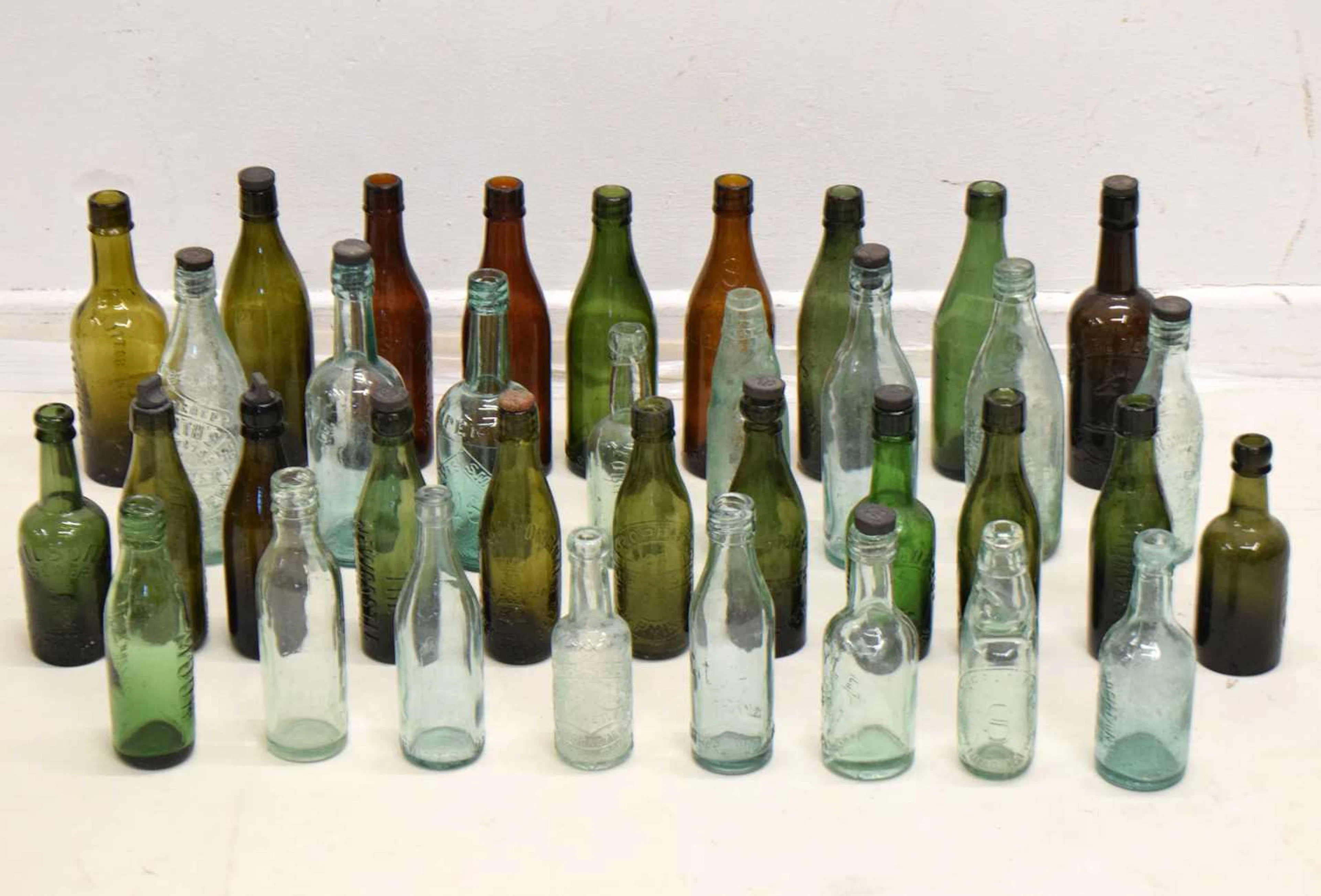 Collection of vintage advertising bottles, etc.