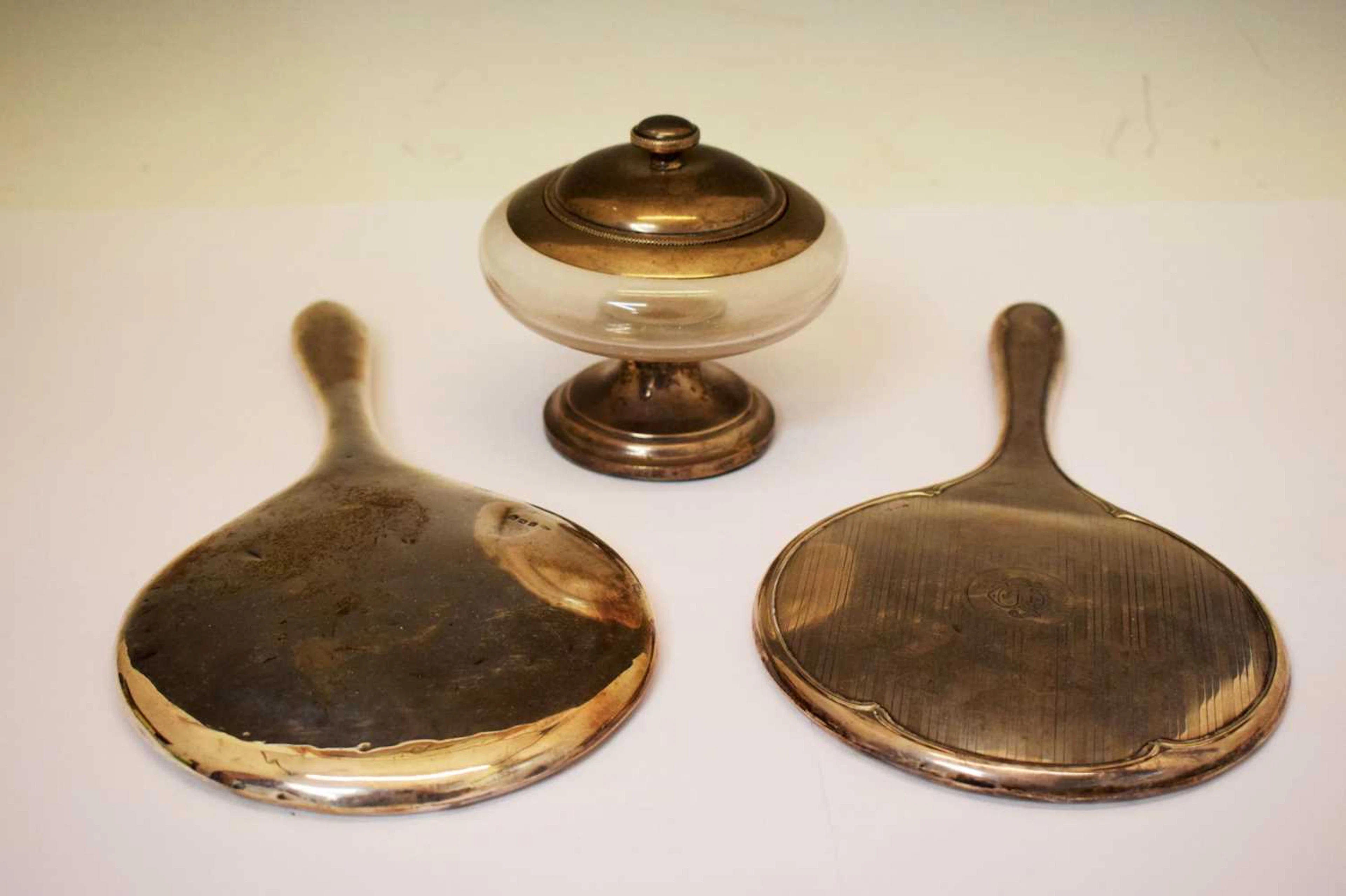 Two silver mounted dressing table mirrors, and a George V silver mounted