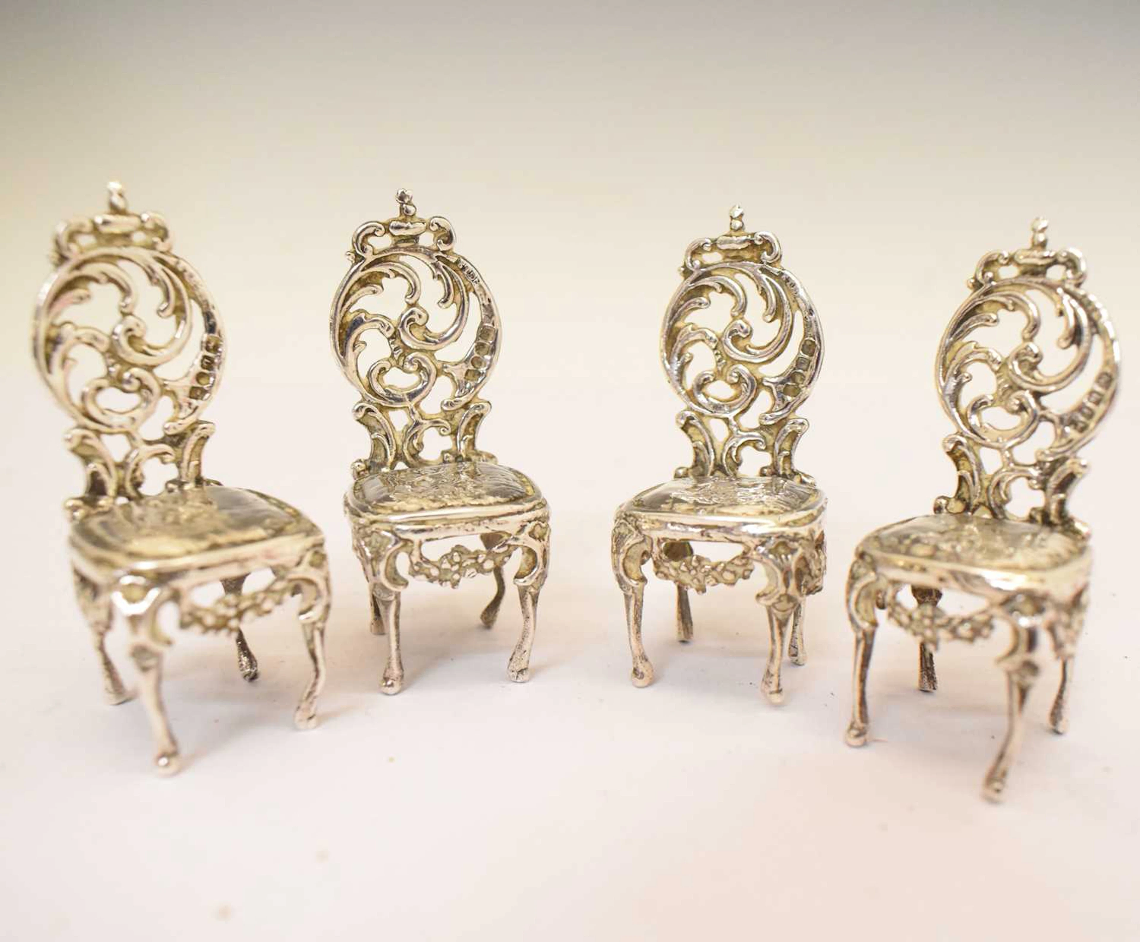 Set of four Continental silver chairs