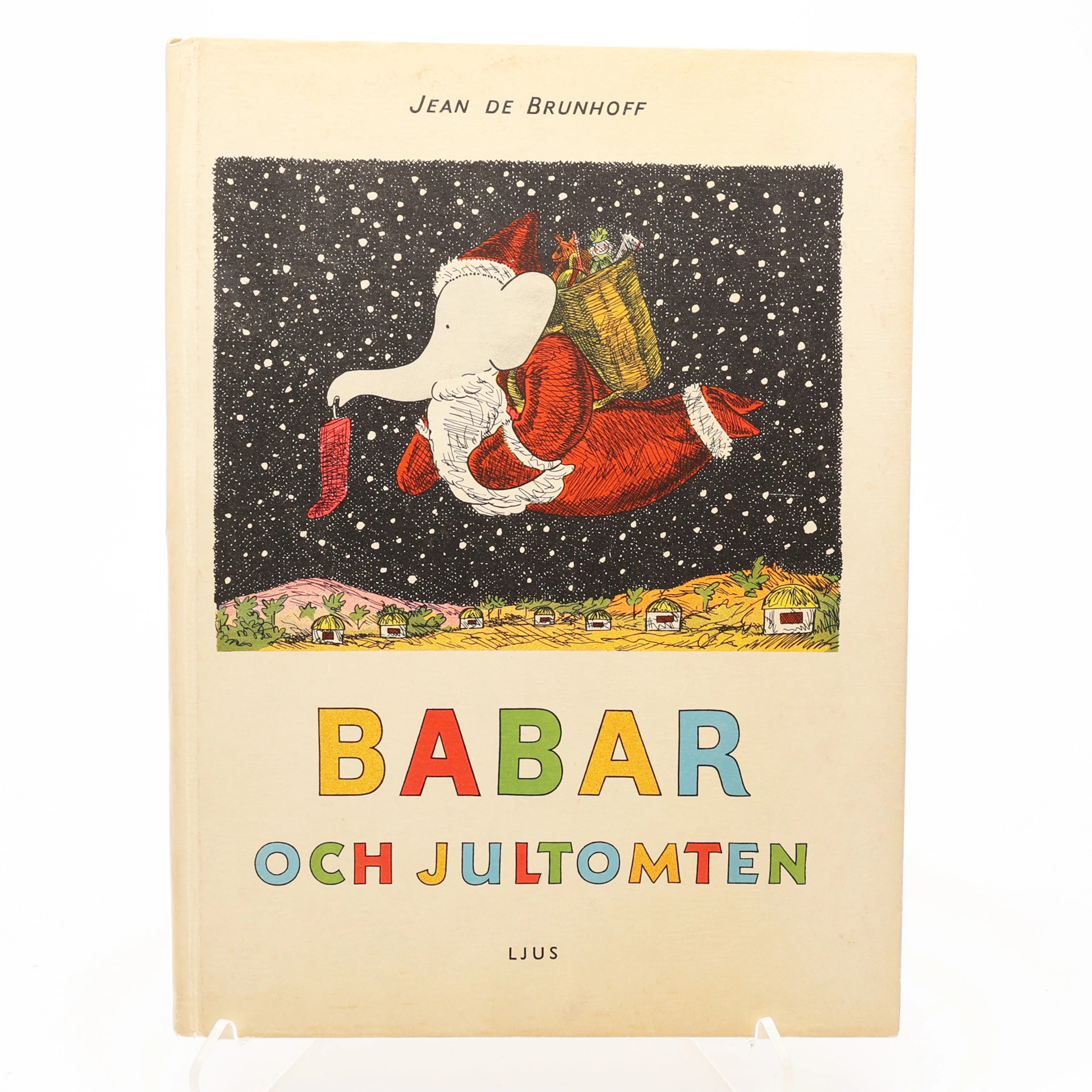 BARNBOK/BABAR. JEAN DE BRUNHOFF'S BABAR OCH JULTOMTEN I FÖRSTA SVENSKA