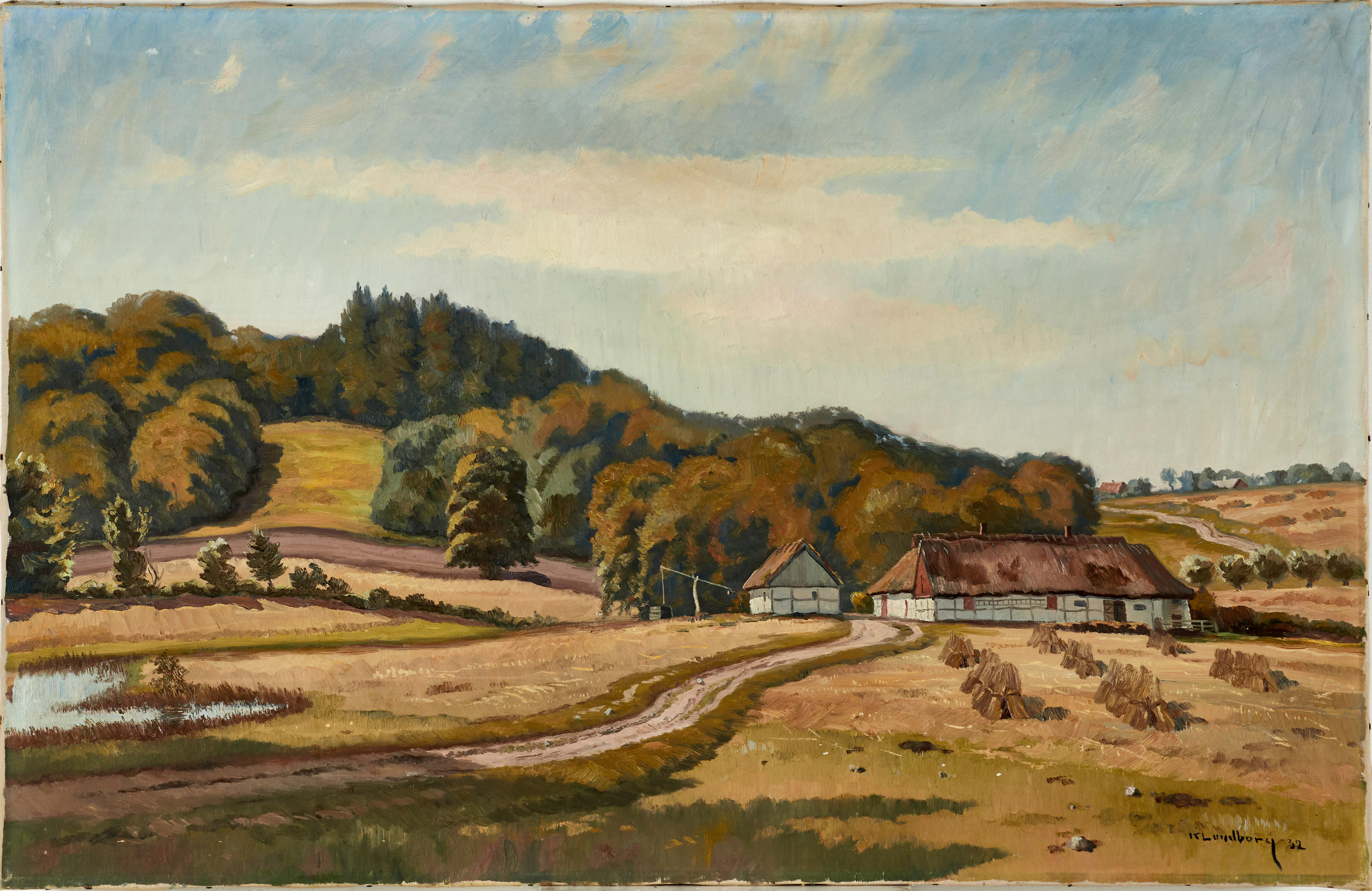 KARL LUNDBORG (1893-1972). Bylandskap med skånegård, signerad och