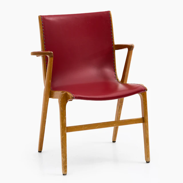 AXEL LARSSON. Karmstol "Kungsörstolen", björk, rött konstläder, 1940/50-tal.