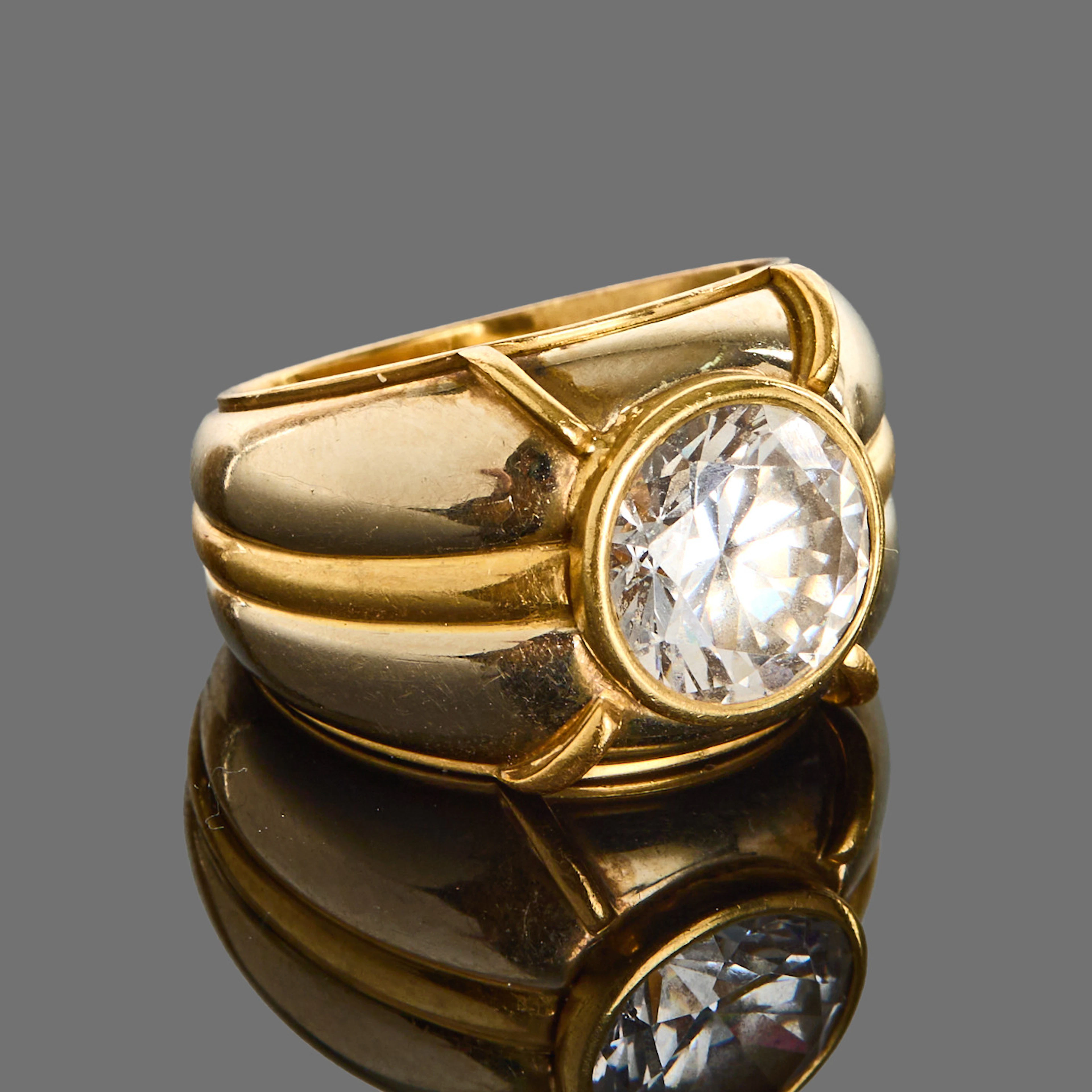 RING, 18k guld med en bezel infattad cubic zirkon.