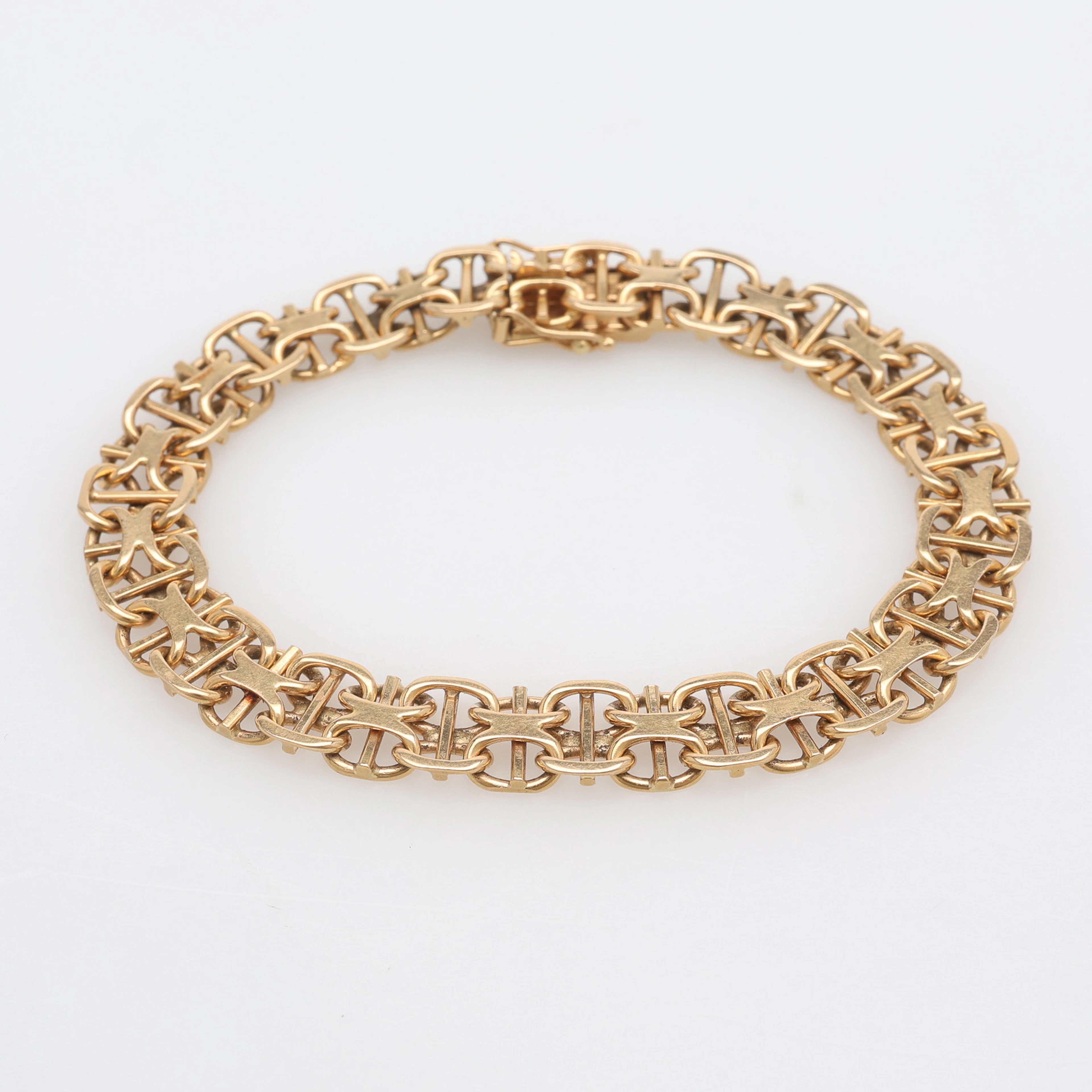 ARMBAND, x-länk med stav, 18 k guld, 20,9 g.