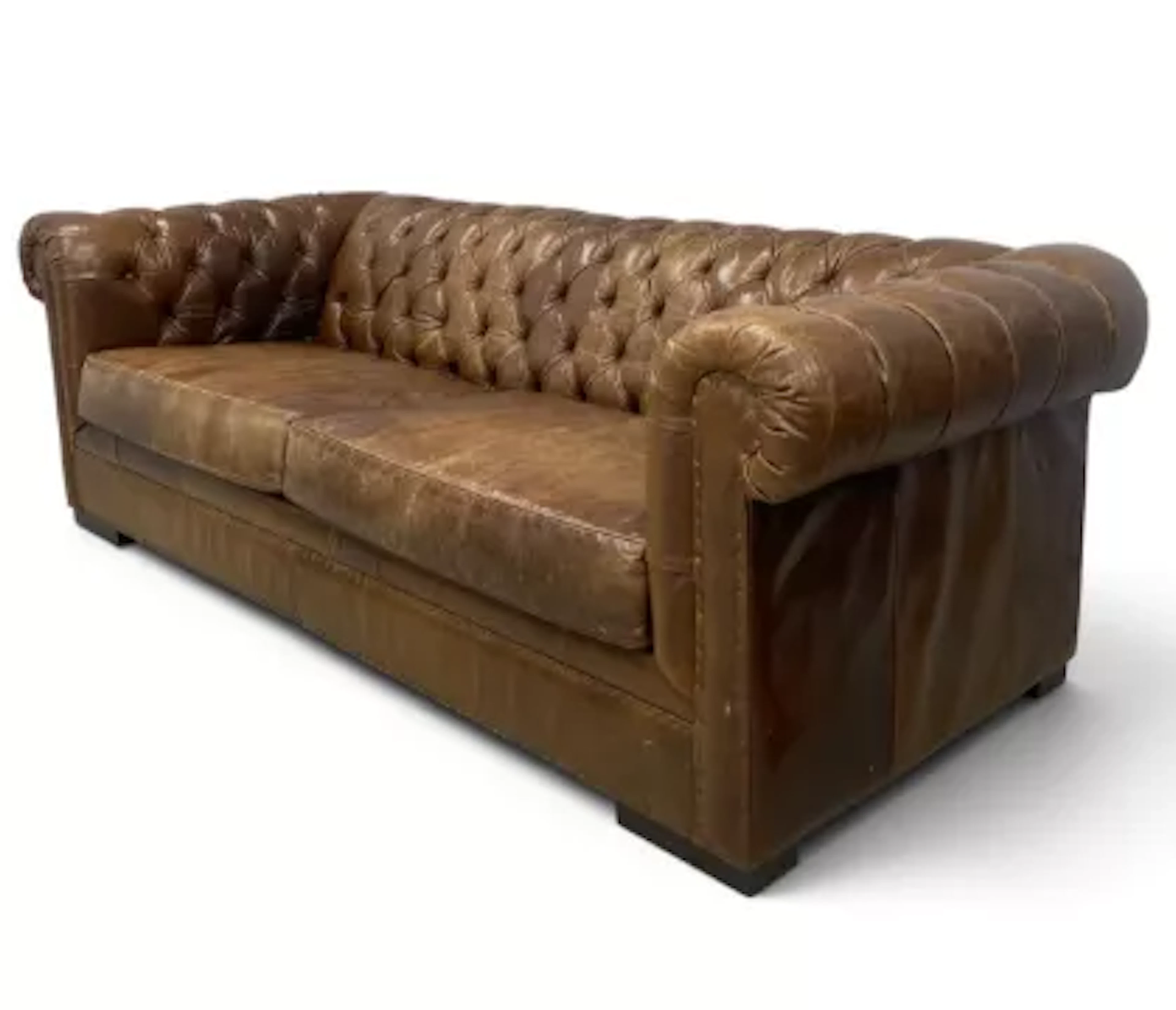 A contemporary brown leather upholstered chesterfield sofa with two