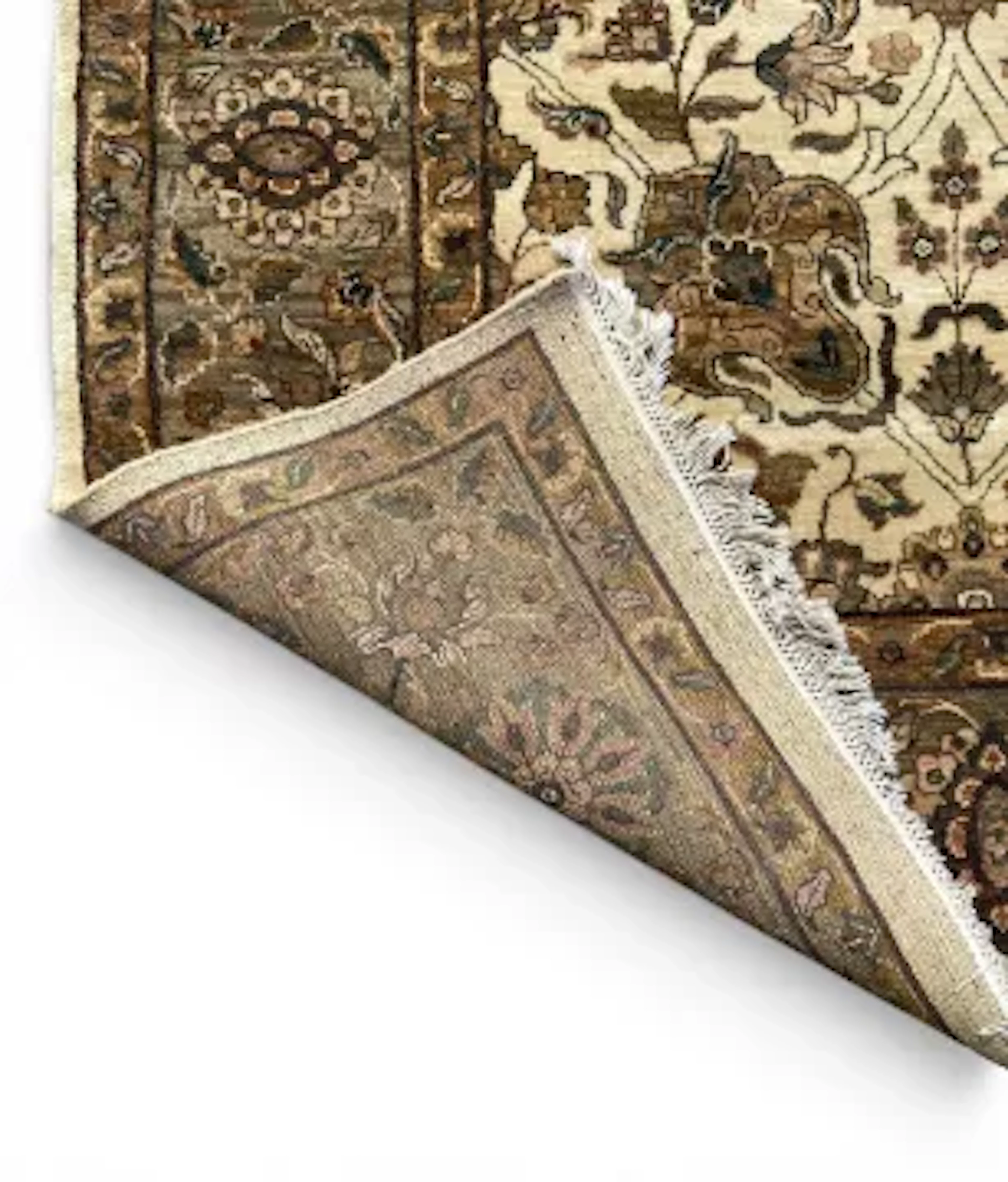 A large Kashan carpet with scrolling foliate motifs on a biscuit ground