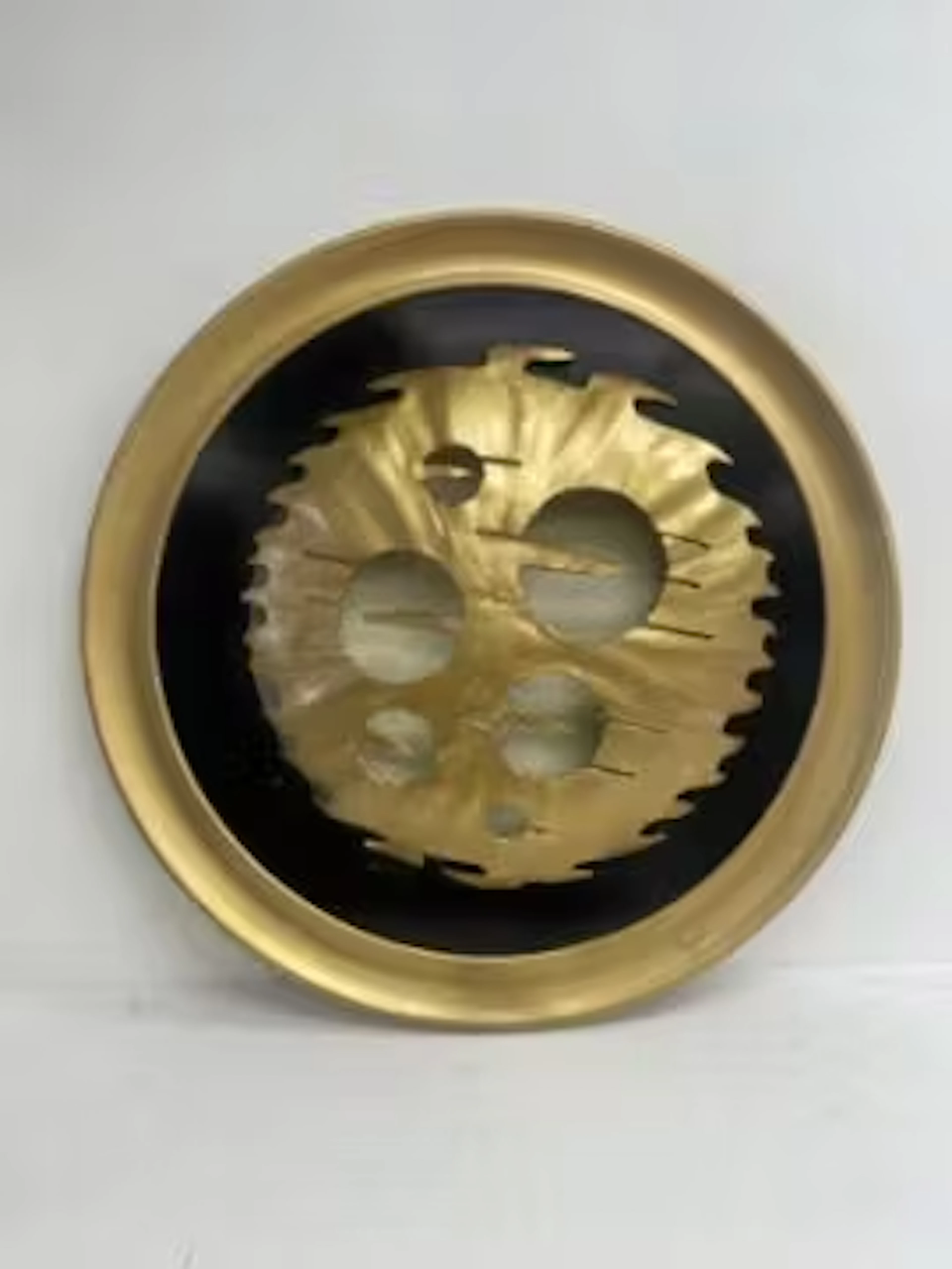 A large 1970's vintage wall art style light in the form of a decorative