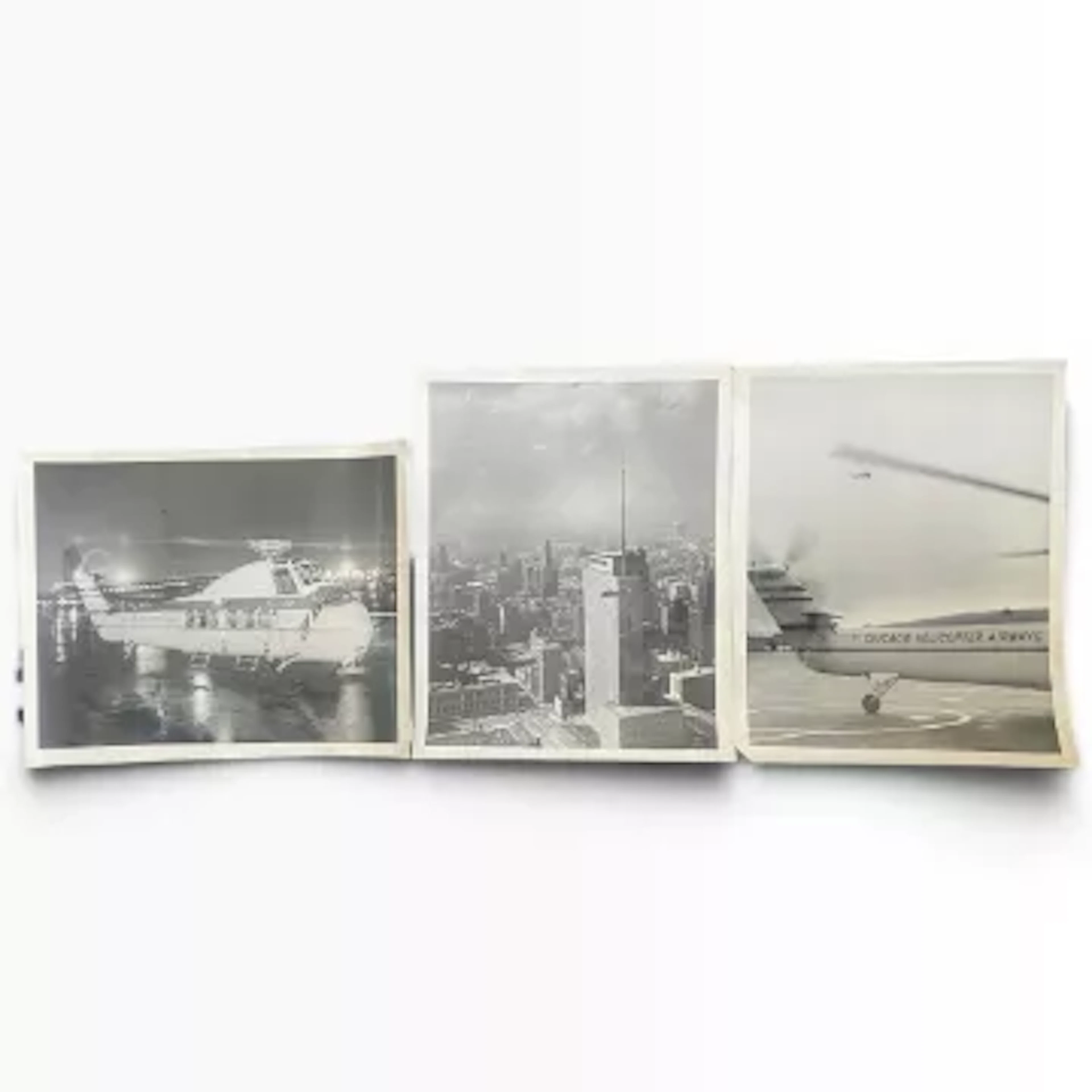 A group of three photographic prints, black and white, 'Chicago Helicopter