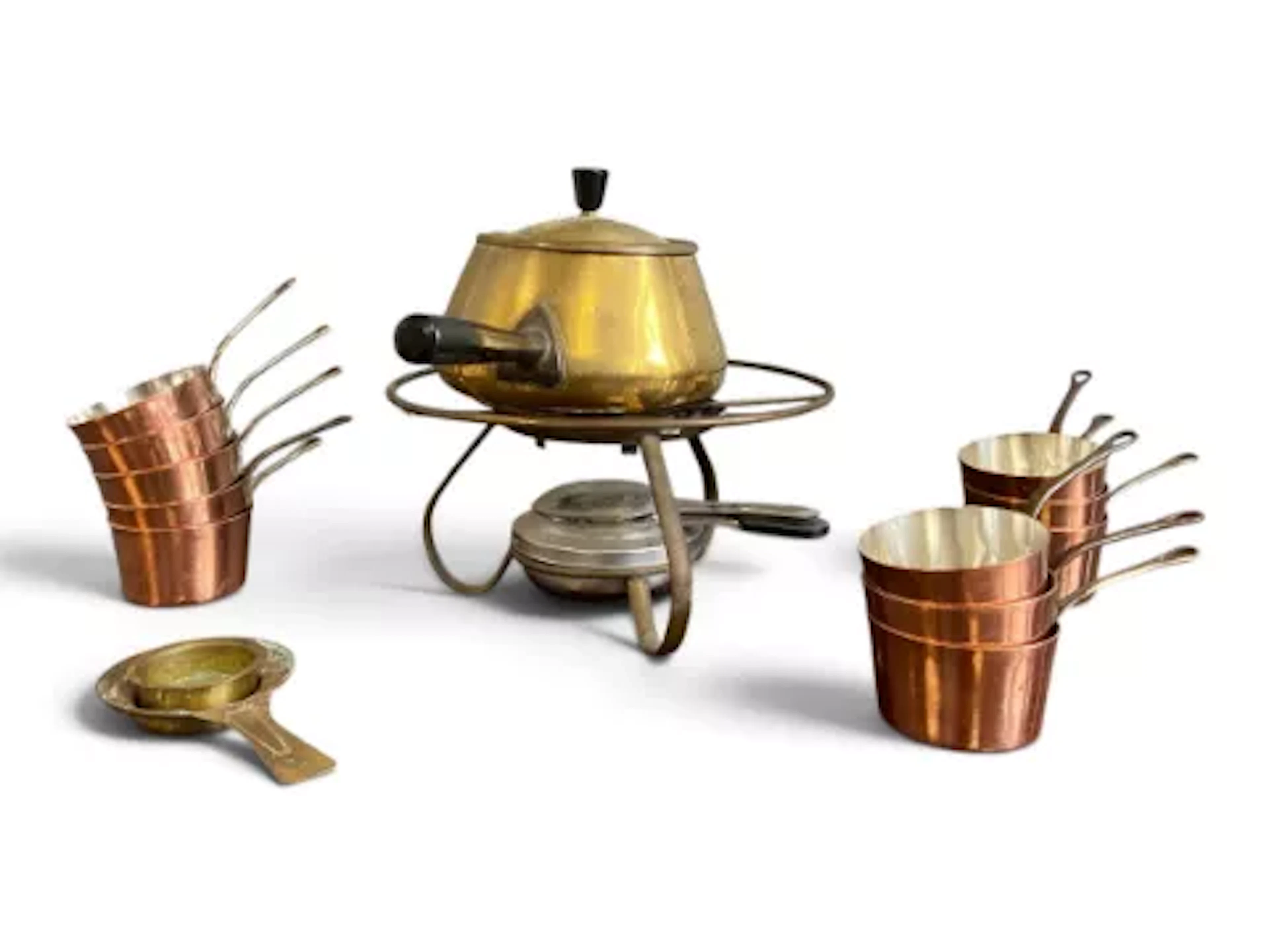 A vintage brass fondue set and burner along with a collection of miniature