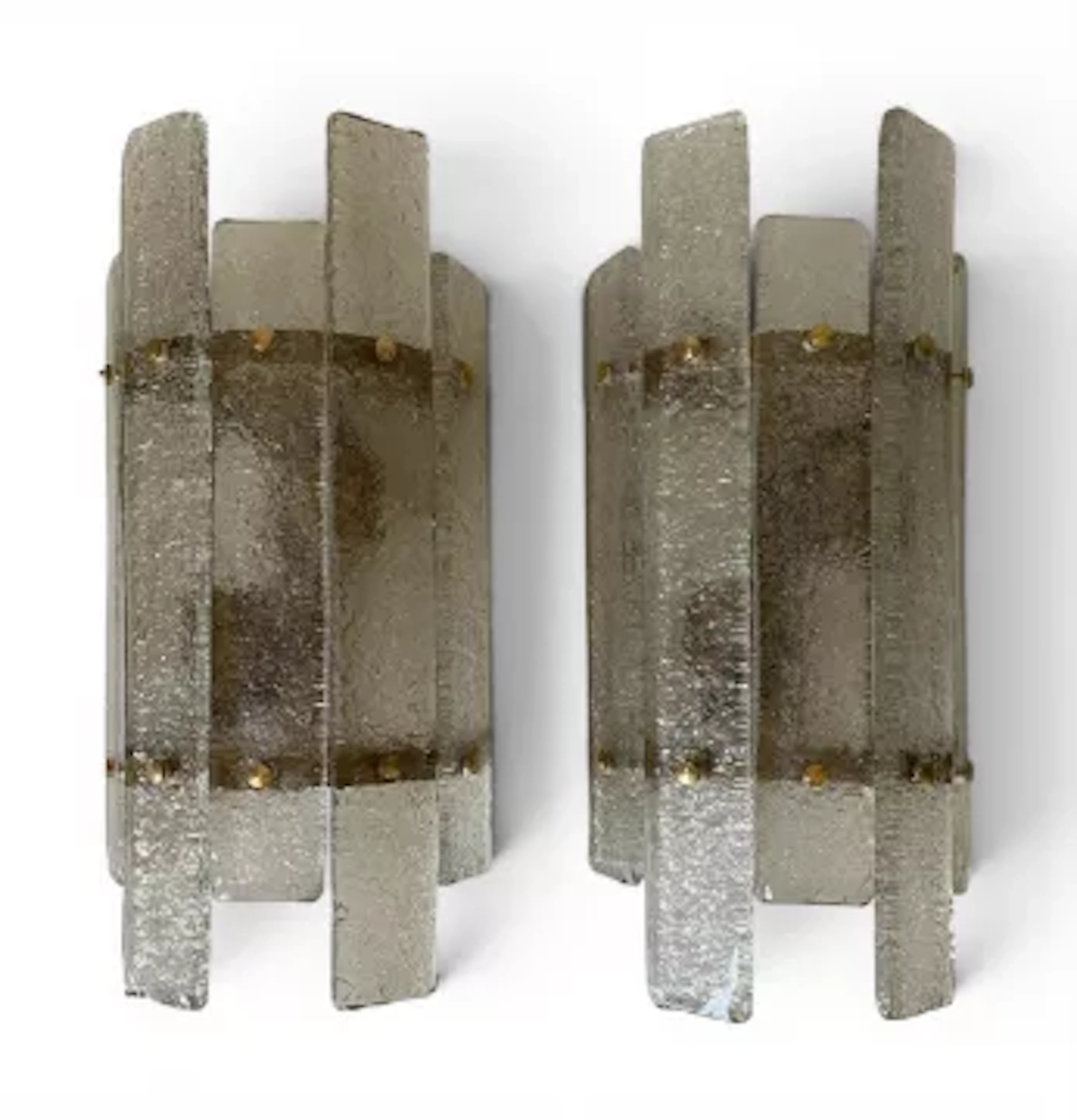 A pair of contemporary Eichholtz wall sconces each with faceted handblown