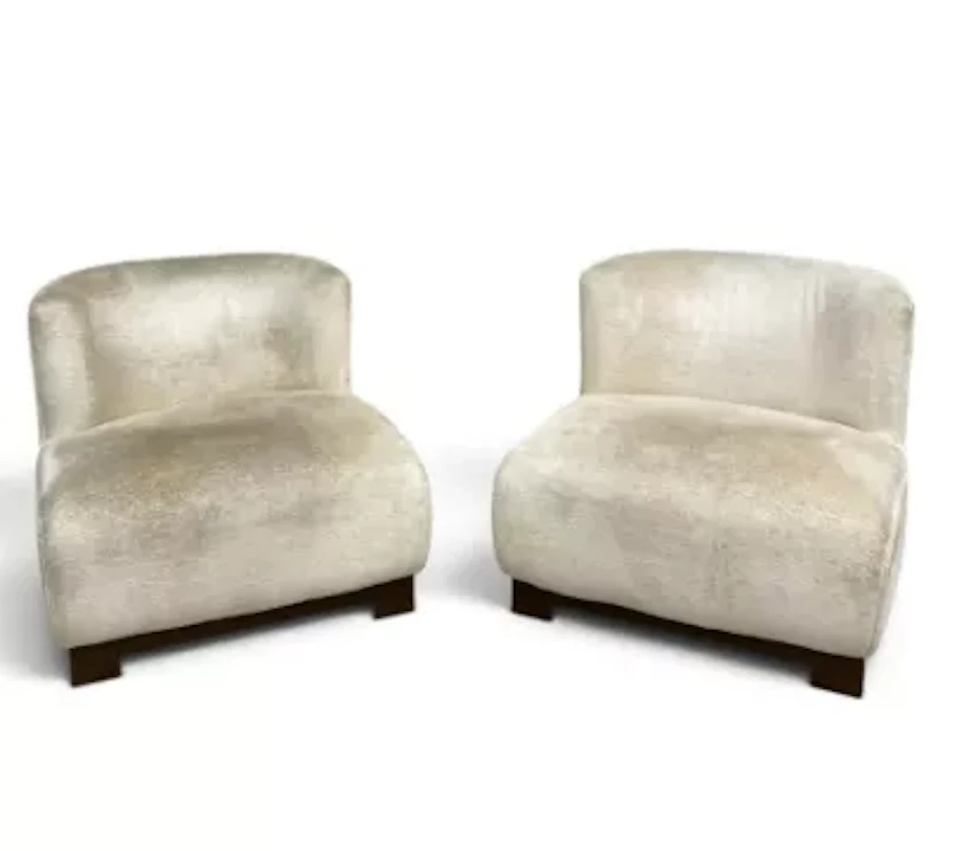 A pair of contemporary accent chairs, based on the Stelio by Eichholtz