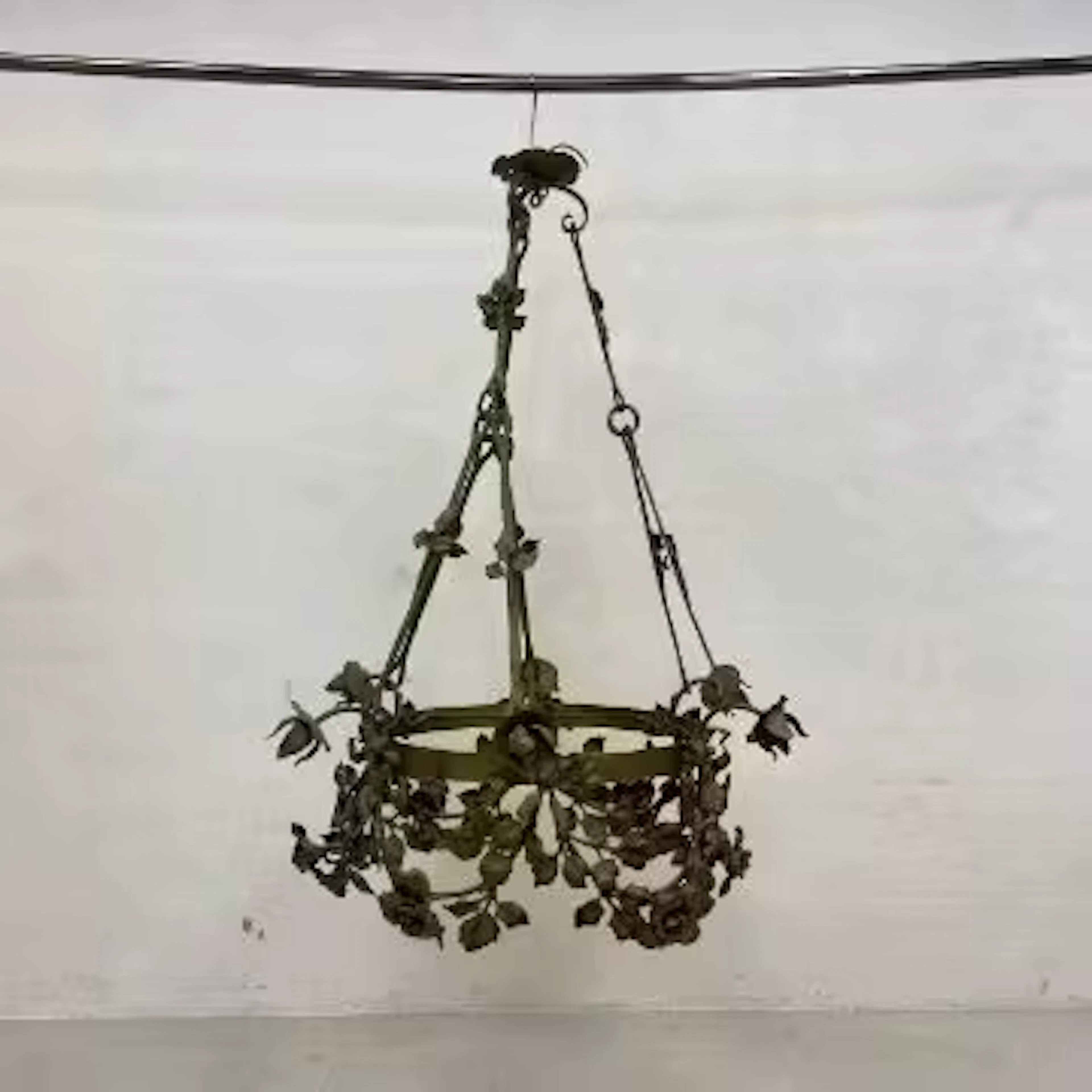 A large French 19th century wrought and gilt metal chandelier having