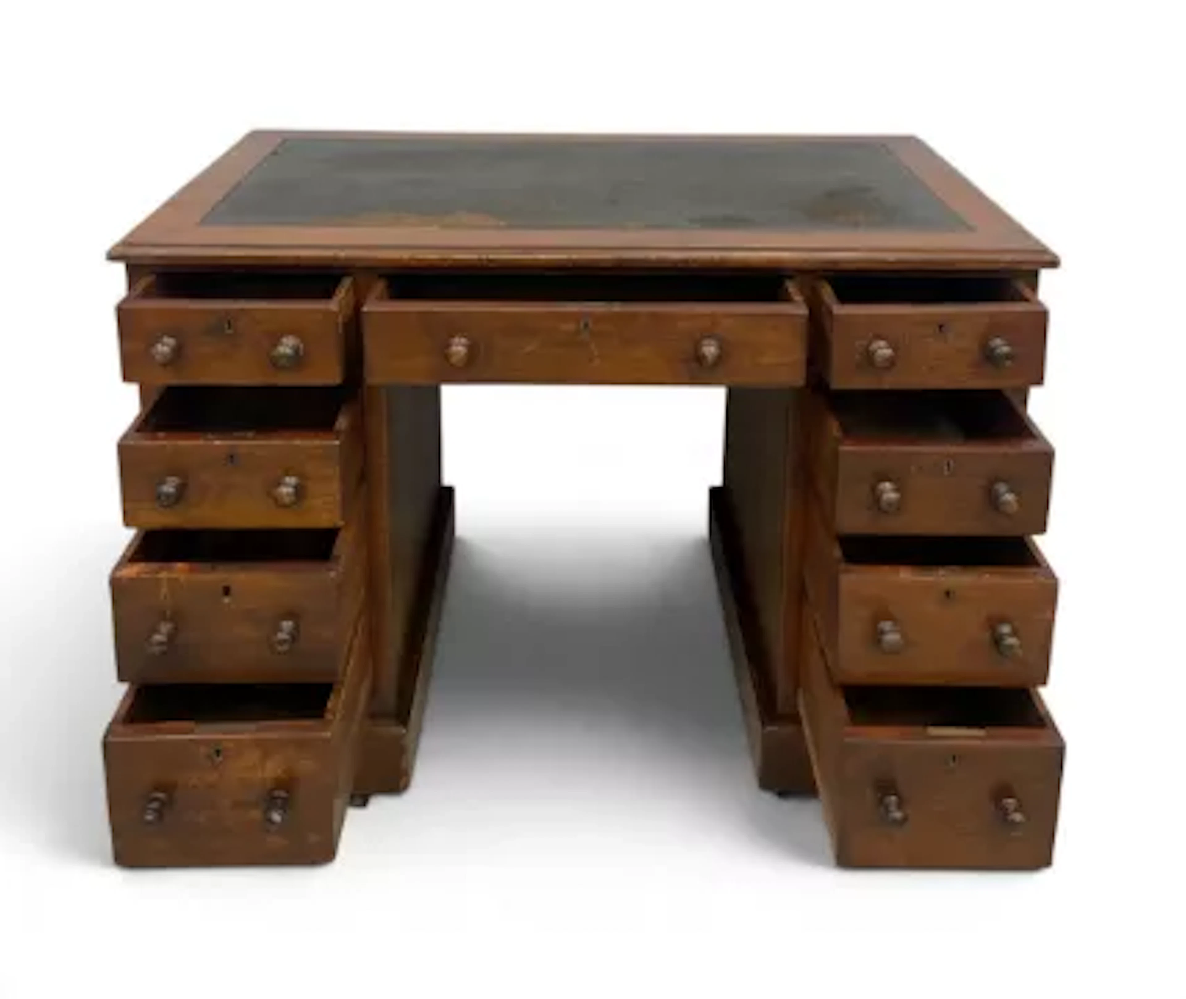 A 19th century mahogany pedestal desk in three sections and an arrangement