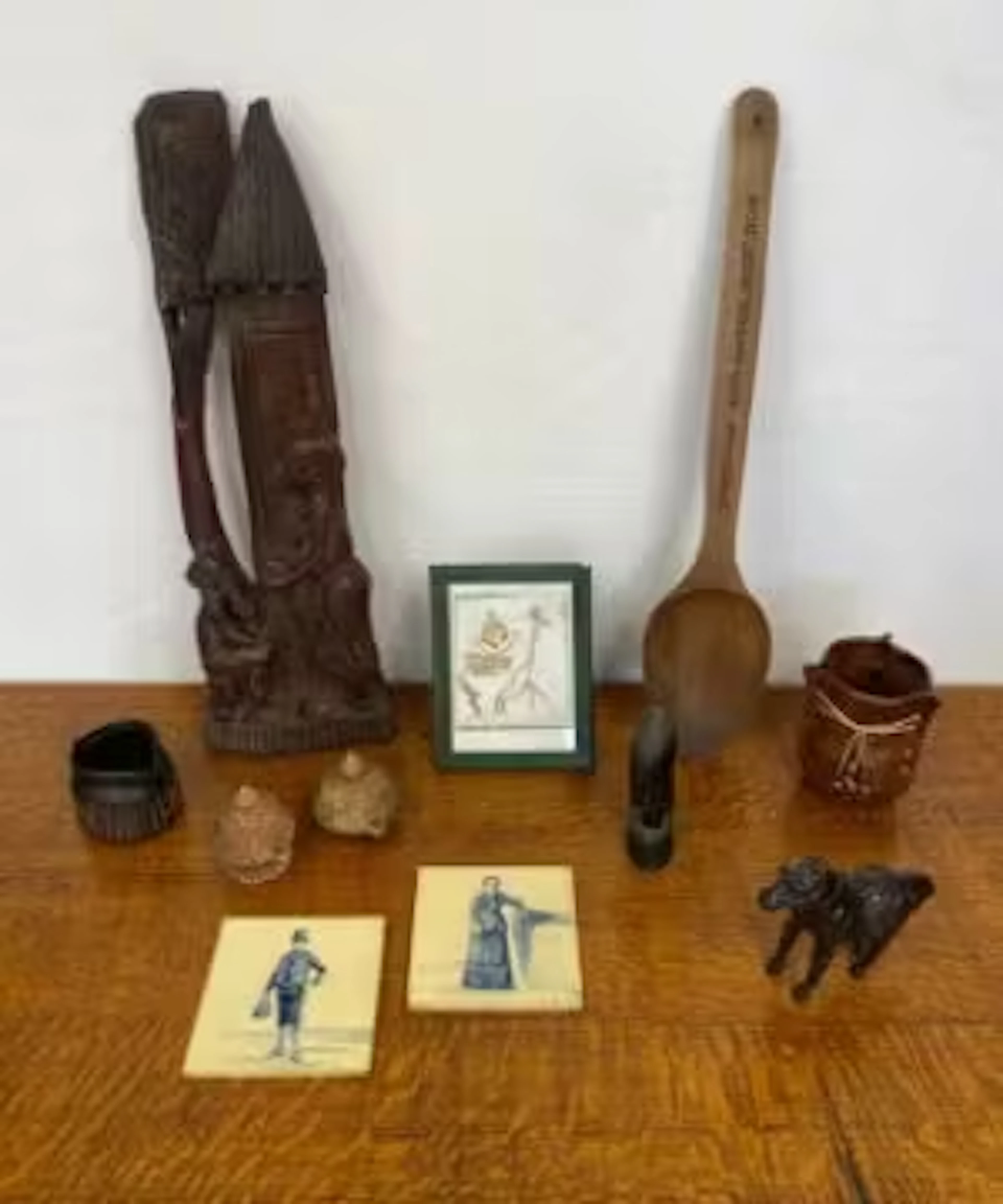 A mixed lot to include carvings, Dutch blue and white tiles, other