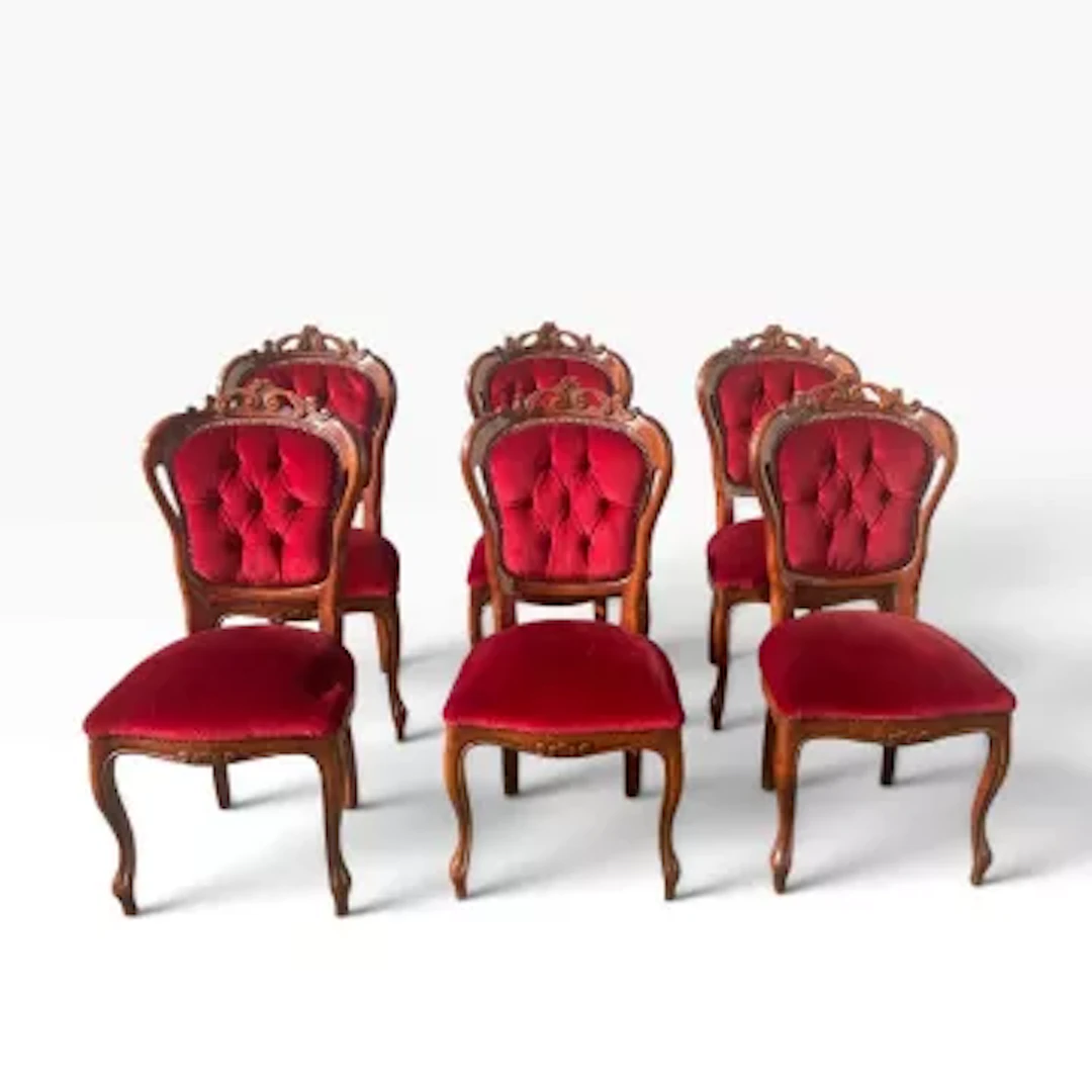 A set of six Victorian style dining chairs with deep buttoned upholstery