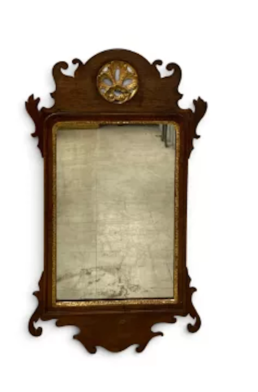 A Georgian mahogany framed fret carved wall mirror with gilt shell
