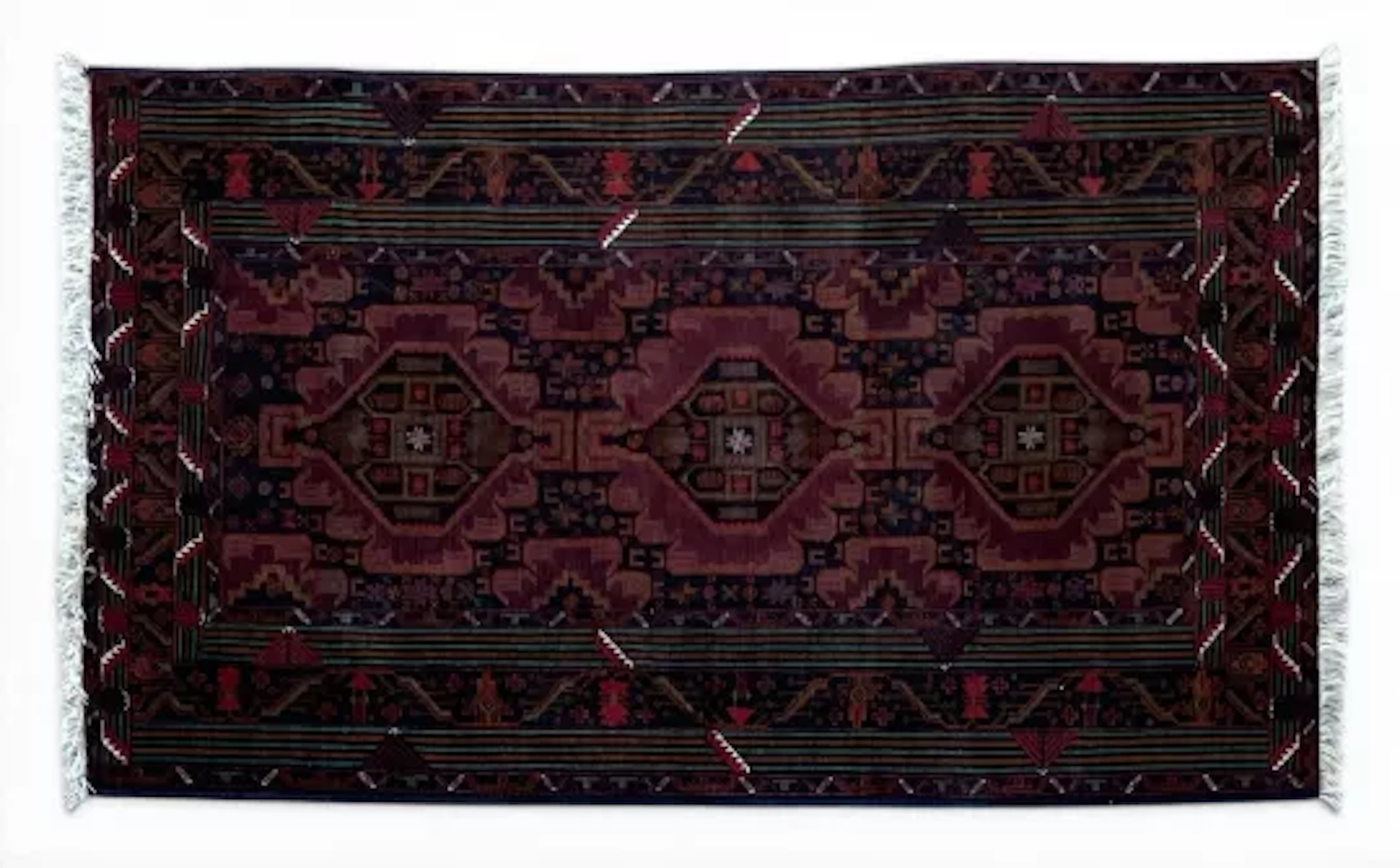 An Afghan Baluch carpet with triple lozenge medallions on a midnight