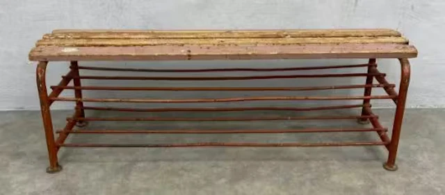 An early to mid 20th century industrial luggage rack or bench with