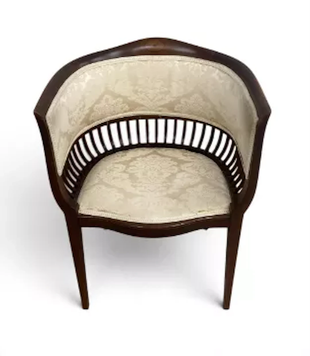 An Edwardian mahogany tub or barrel back parlour armchair with a marquetry