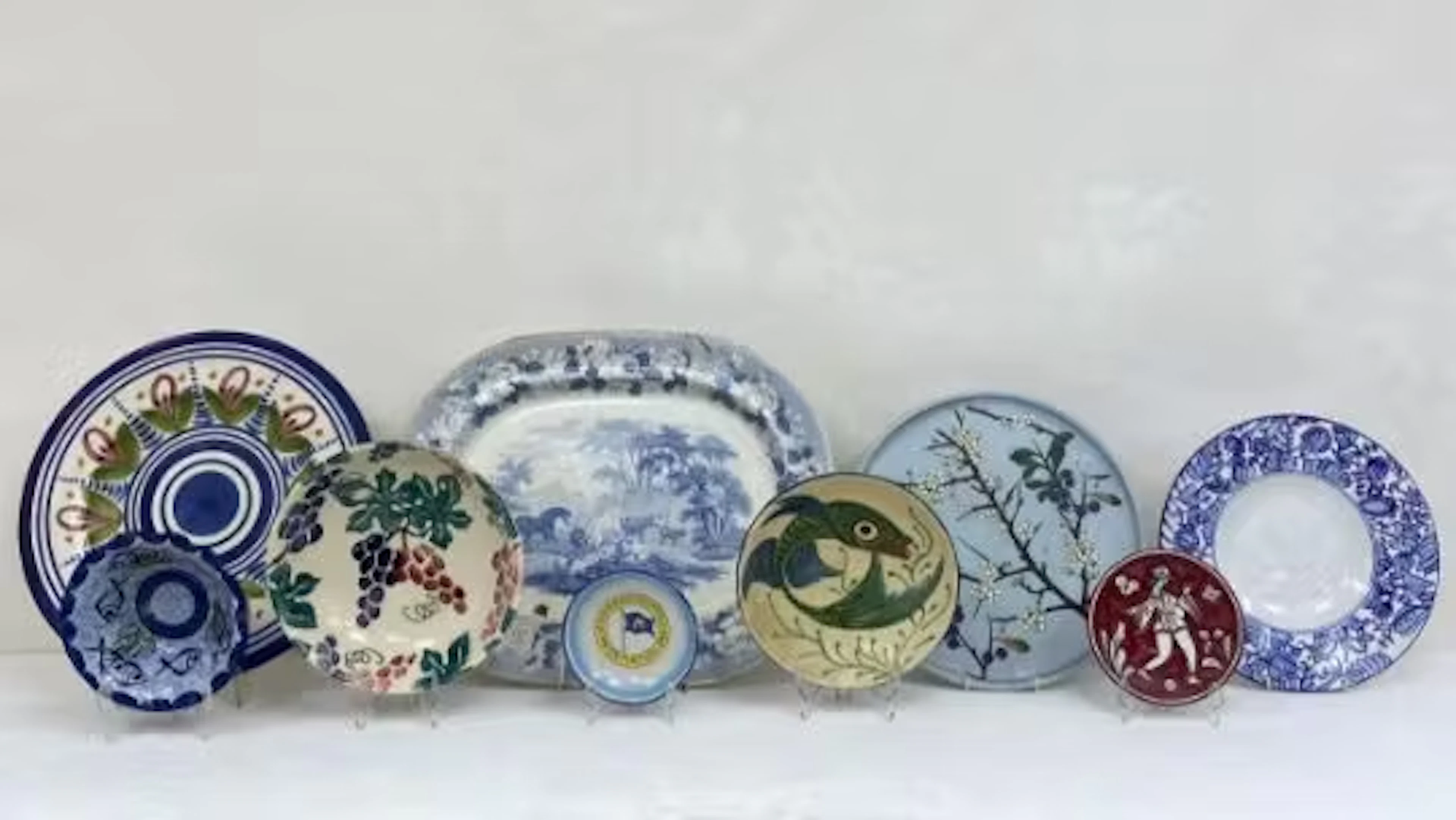 A mixed collection of studio pottery and other ceramic plates to include