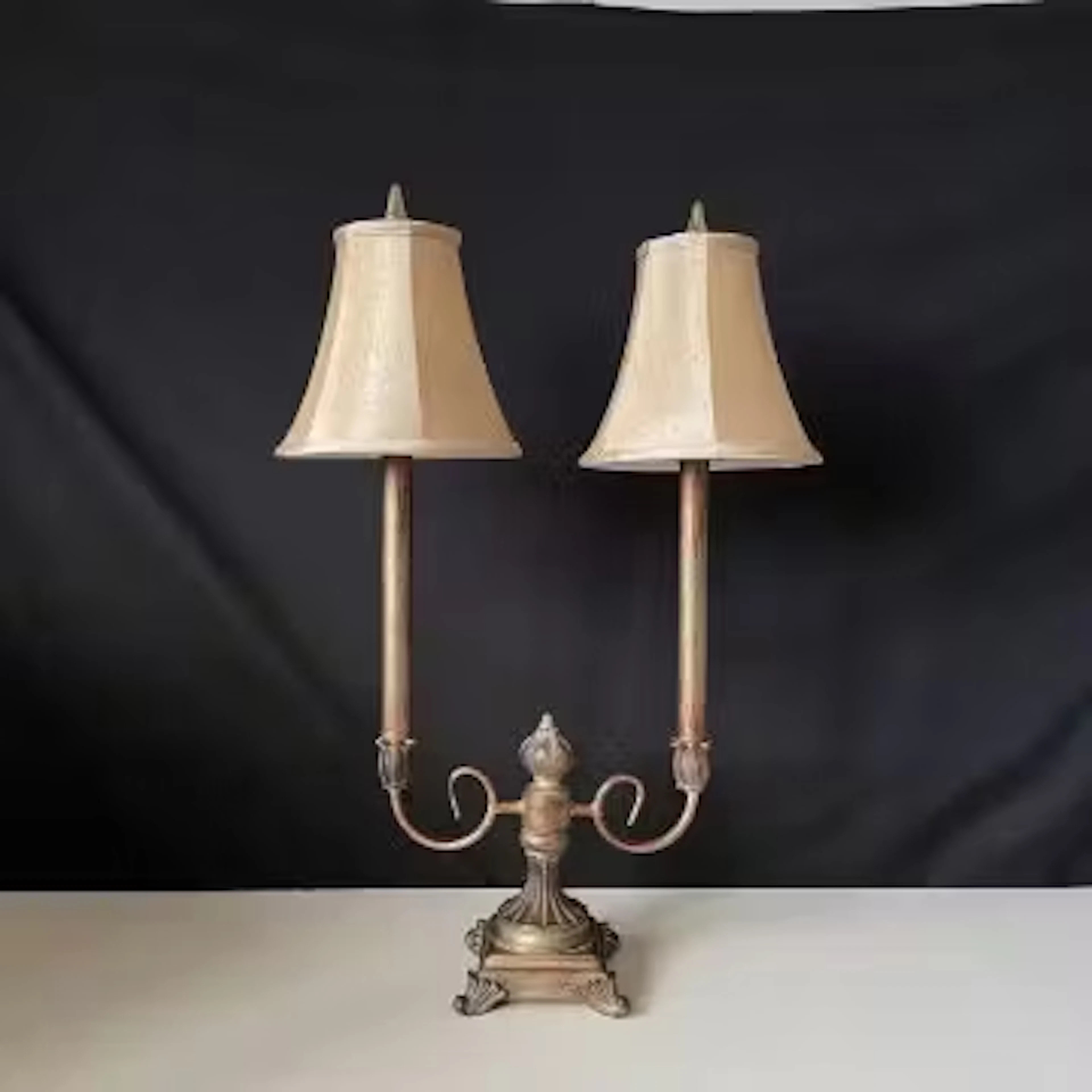 A contemporary cold painted and distressed metal candelabra style