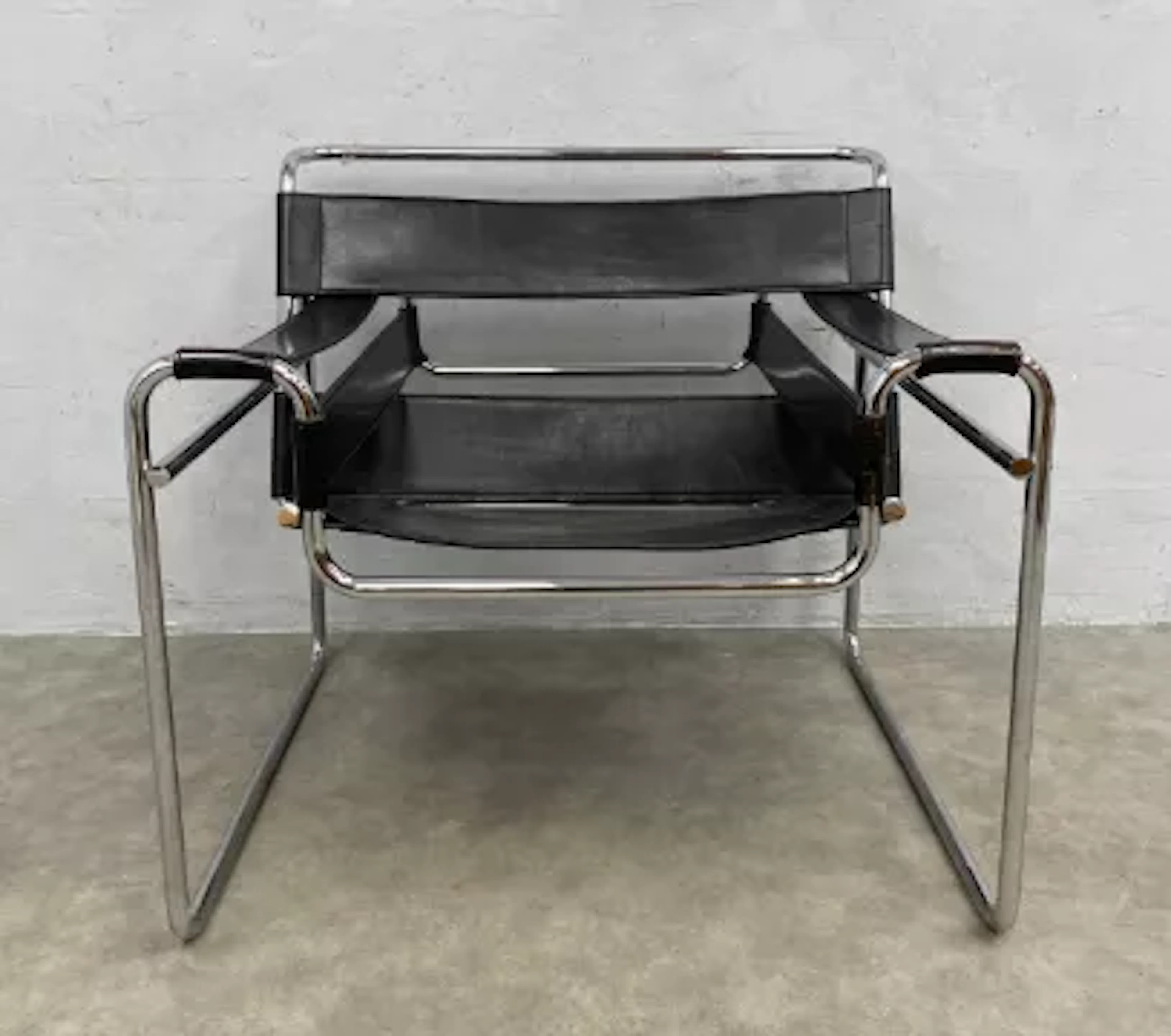 A mid-century black leather and bent chrome Wassily B3 chair after