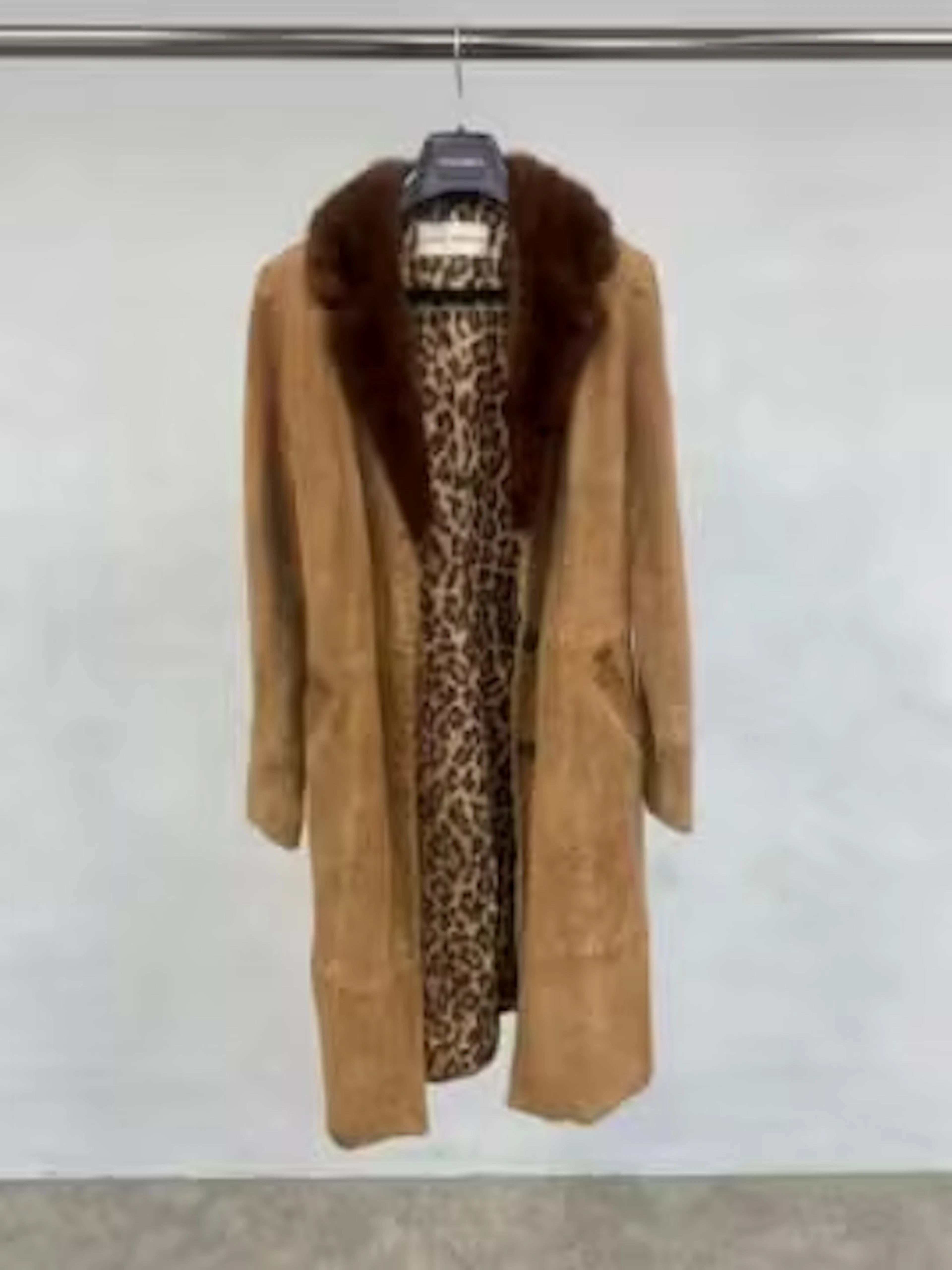 A Dolce and Gabbana ladies coat, suede with fur collar. Medium sized.