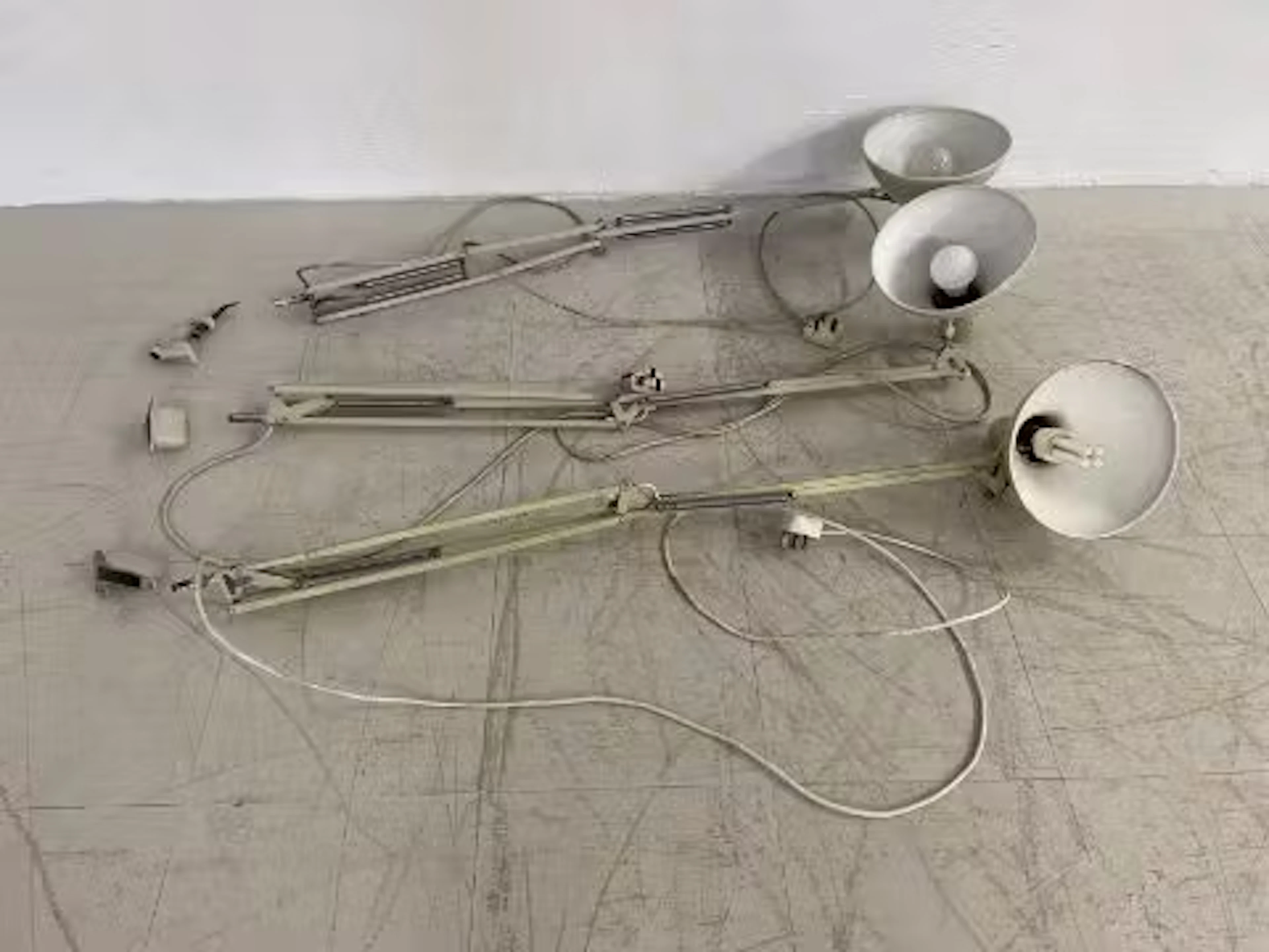 Three vintage articulated anglepoise style lamps to include two wall