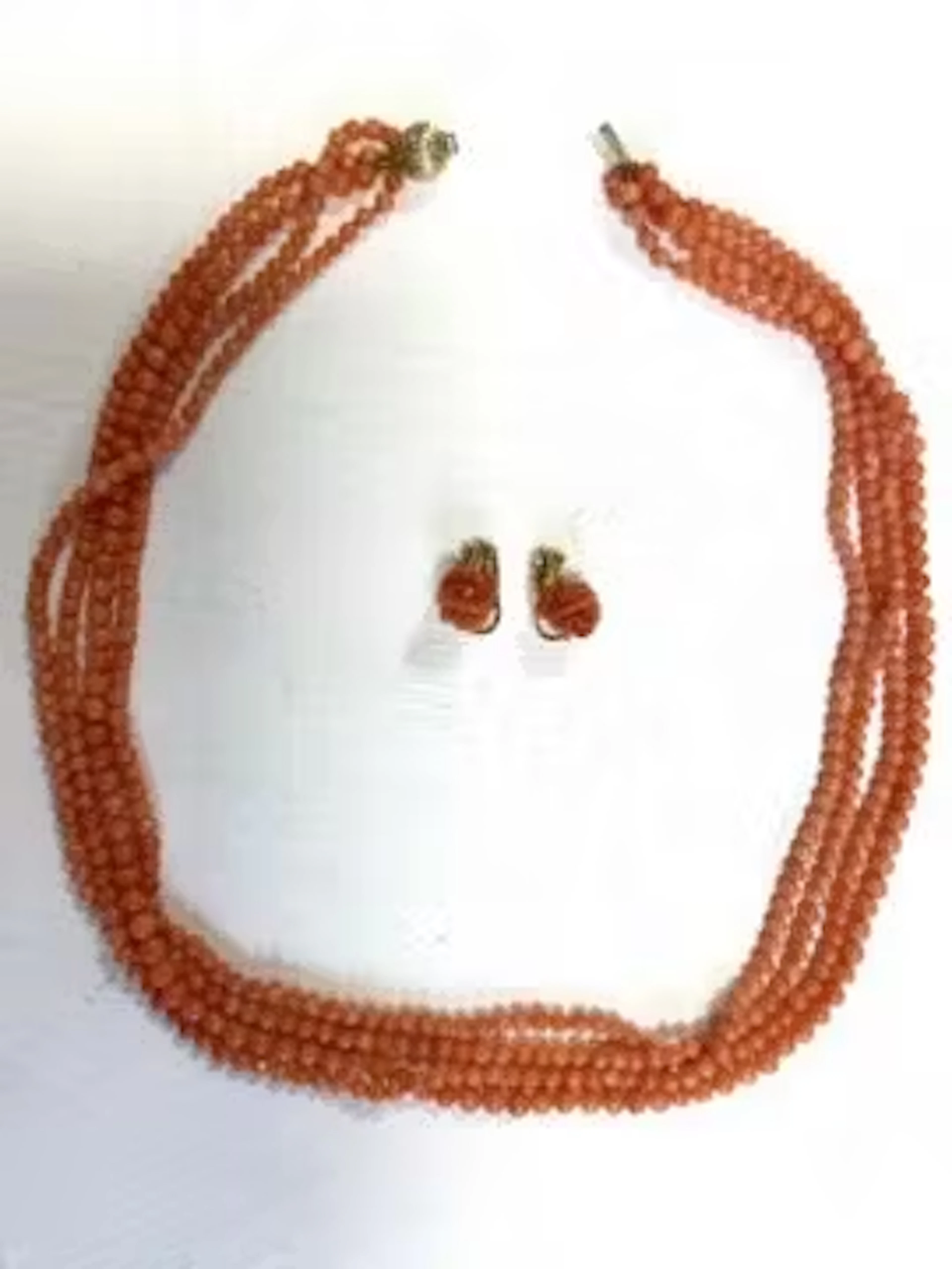A pair of 18ct gold and coral clip-on earrings and a coral necklace