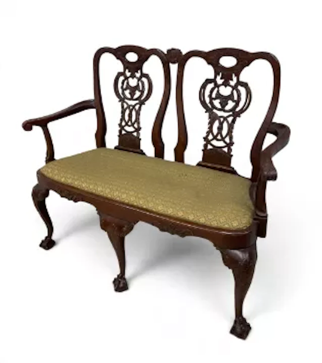 A Chippendale style mahogany double back two seater settee with pierced