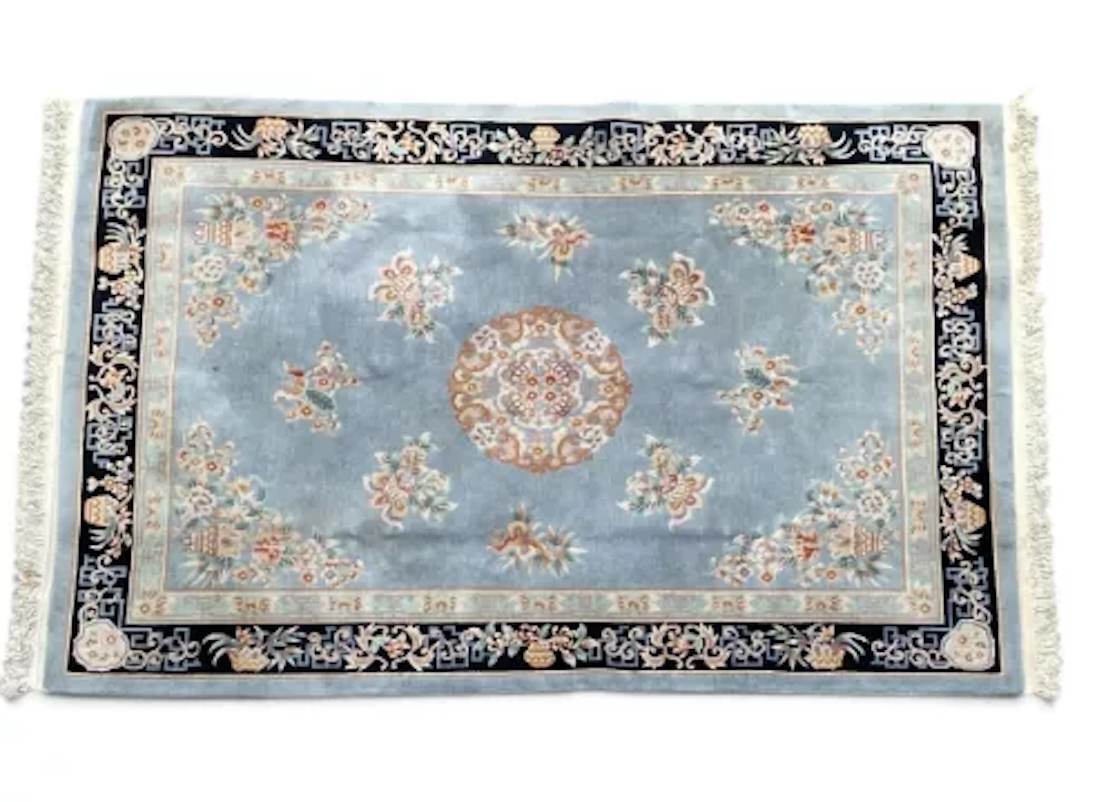 A large 20th century Art Deco style Chinese carpet with a central