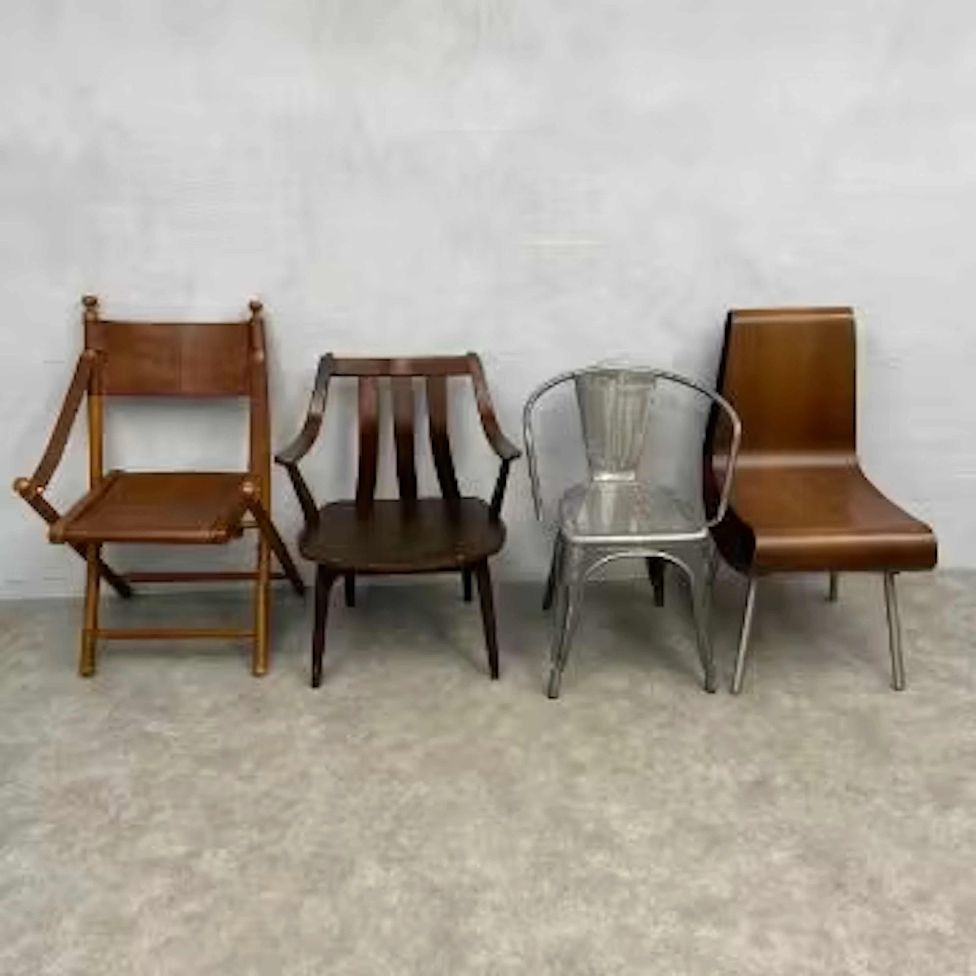 A vintage bent ply Boa chair by Emmemobili together with a tan leather