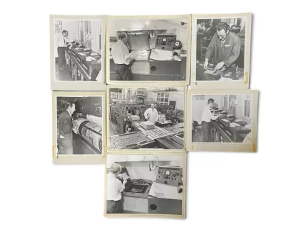 A series of seven photographic prints, black and white, newspaper