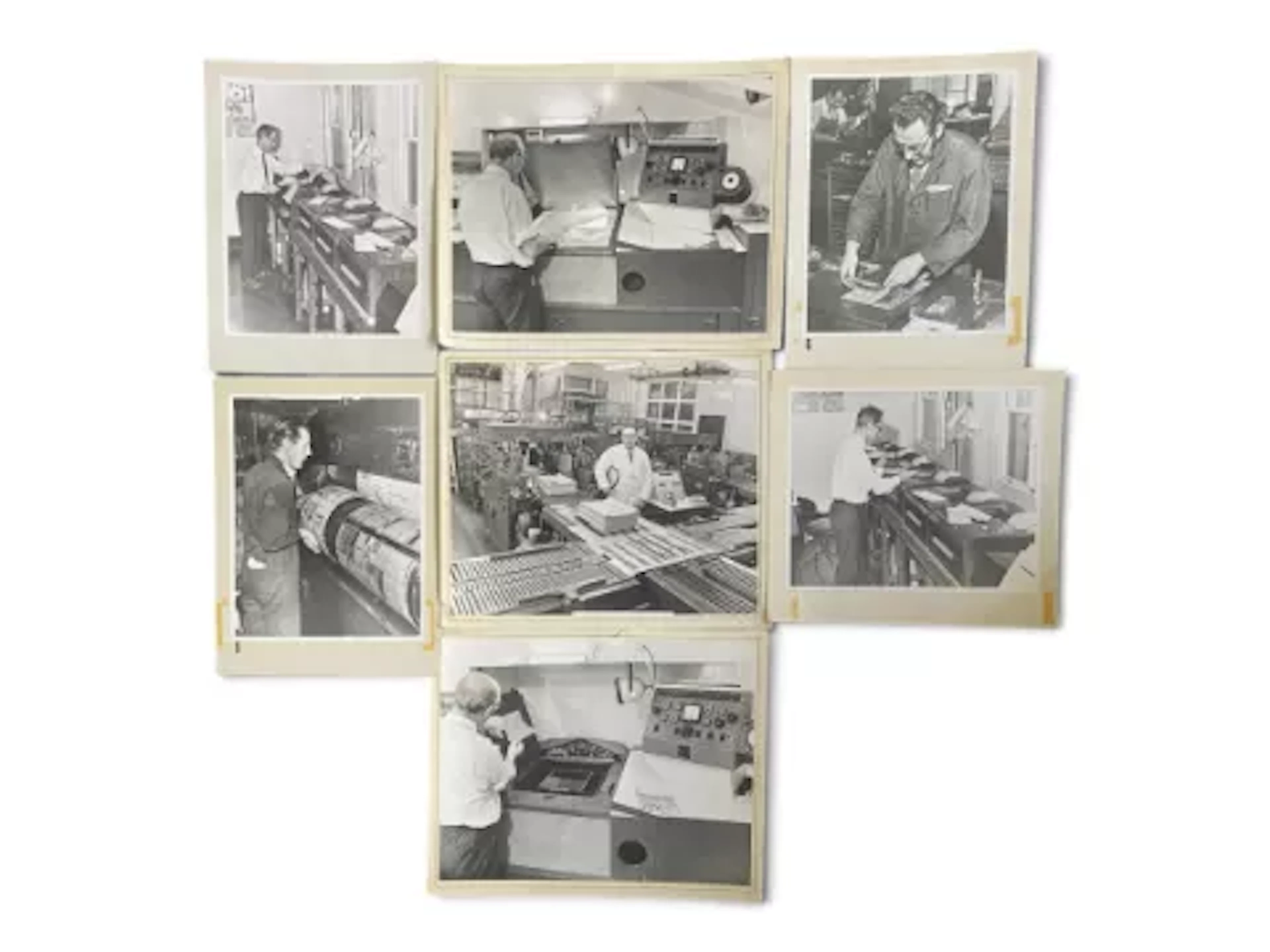 A series of seven photographic prints, black and white, newspaper