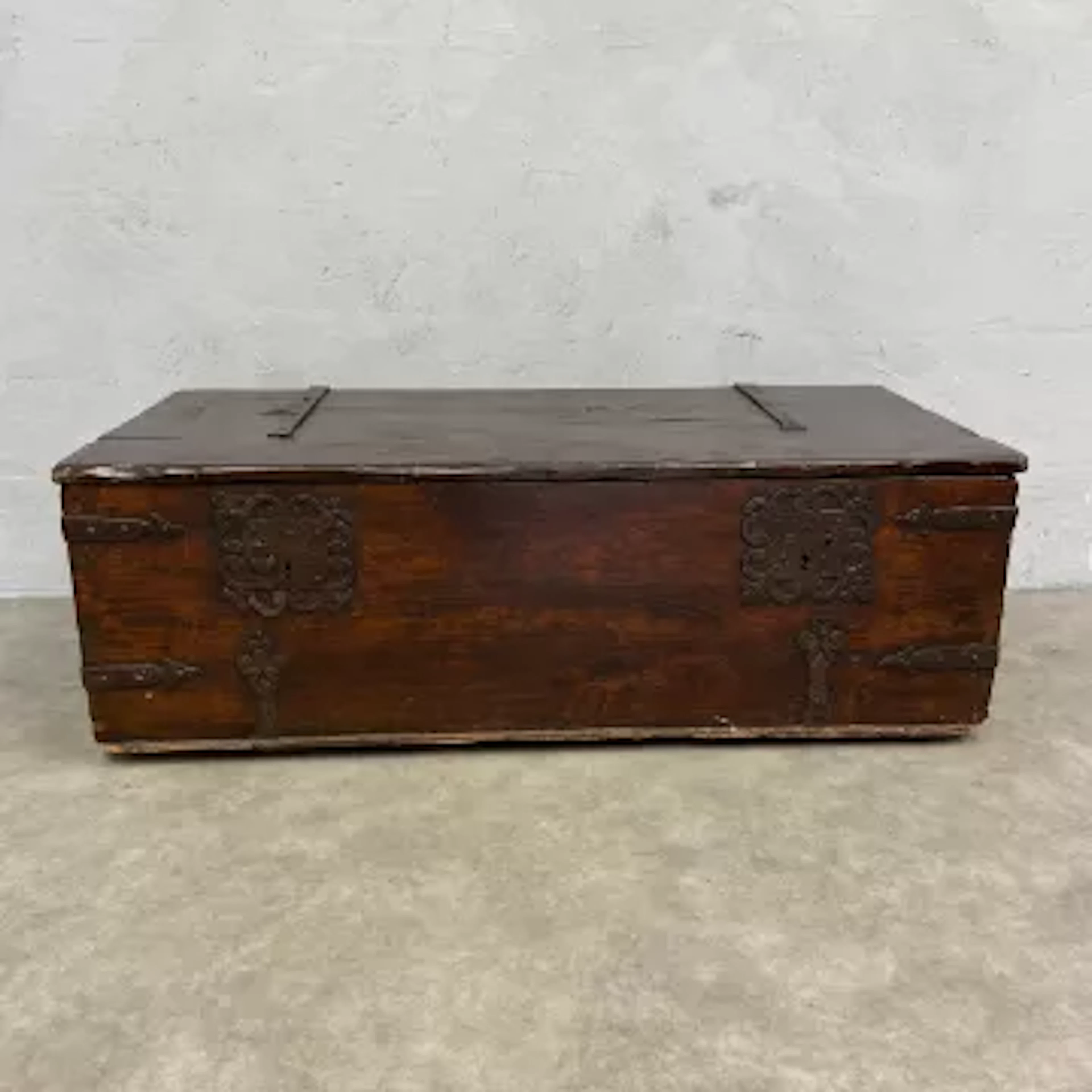 A C.1900 Spanish style coffer of chest with iron clad plank top and