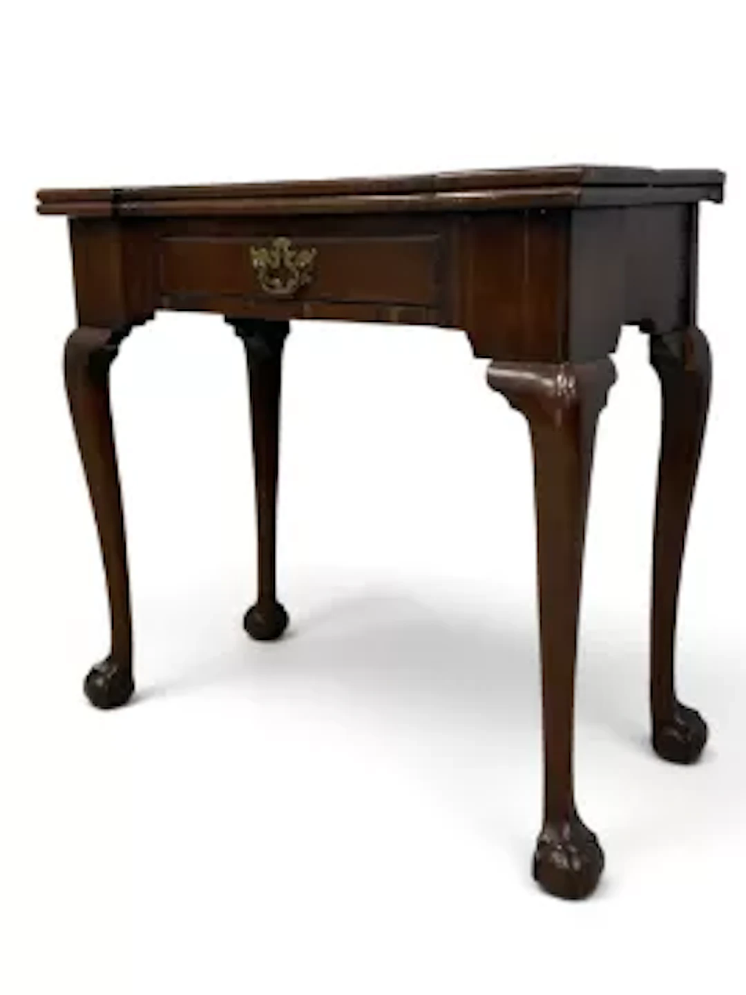 A mid Georgian mahogany card table with foldover top revealing green