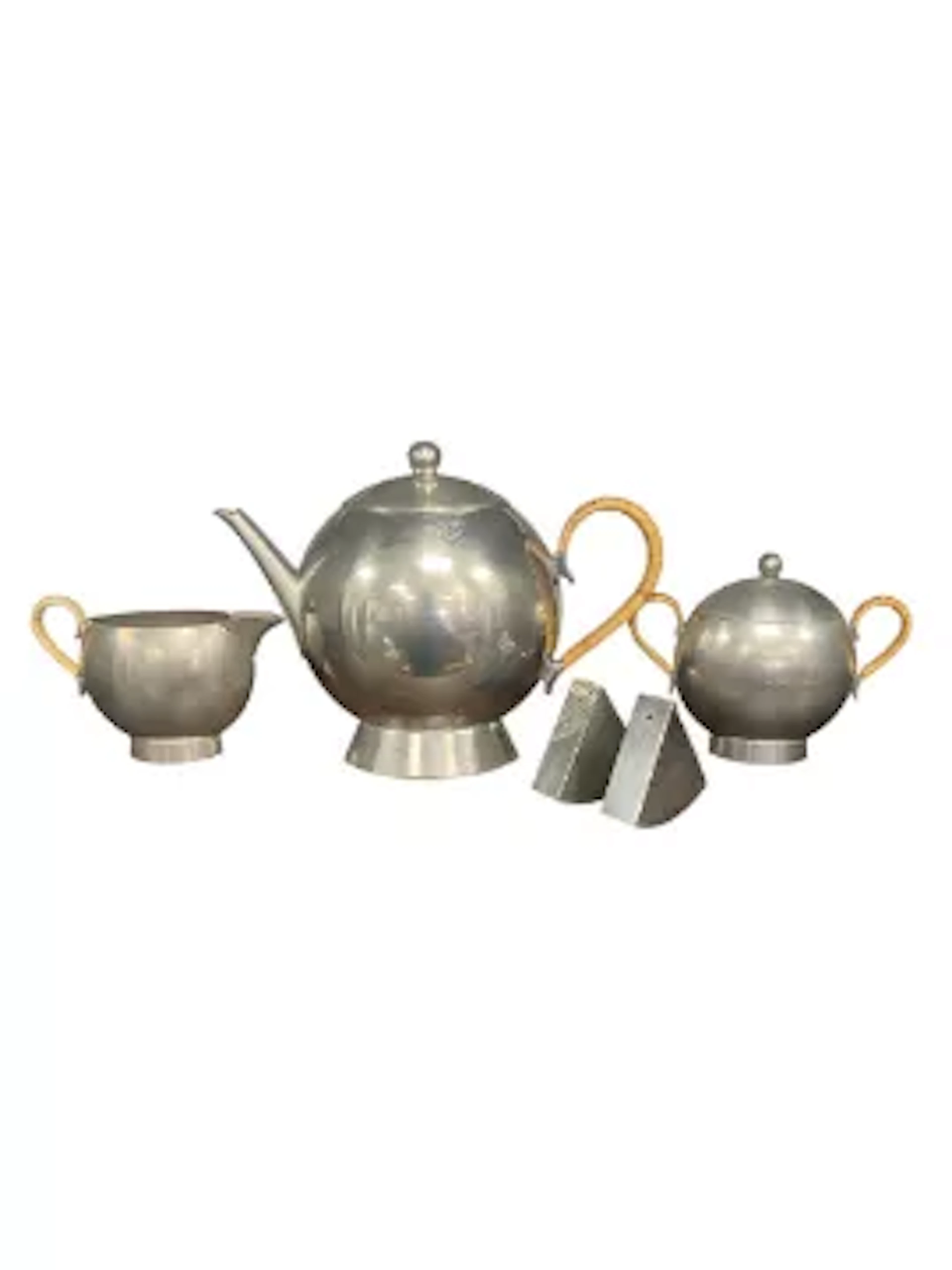 A vintage Art Deco style pewter tea set to include a teapot, sugar