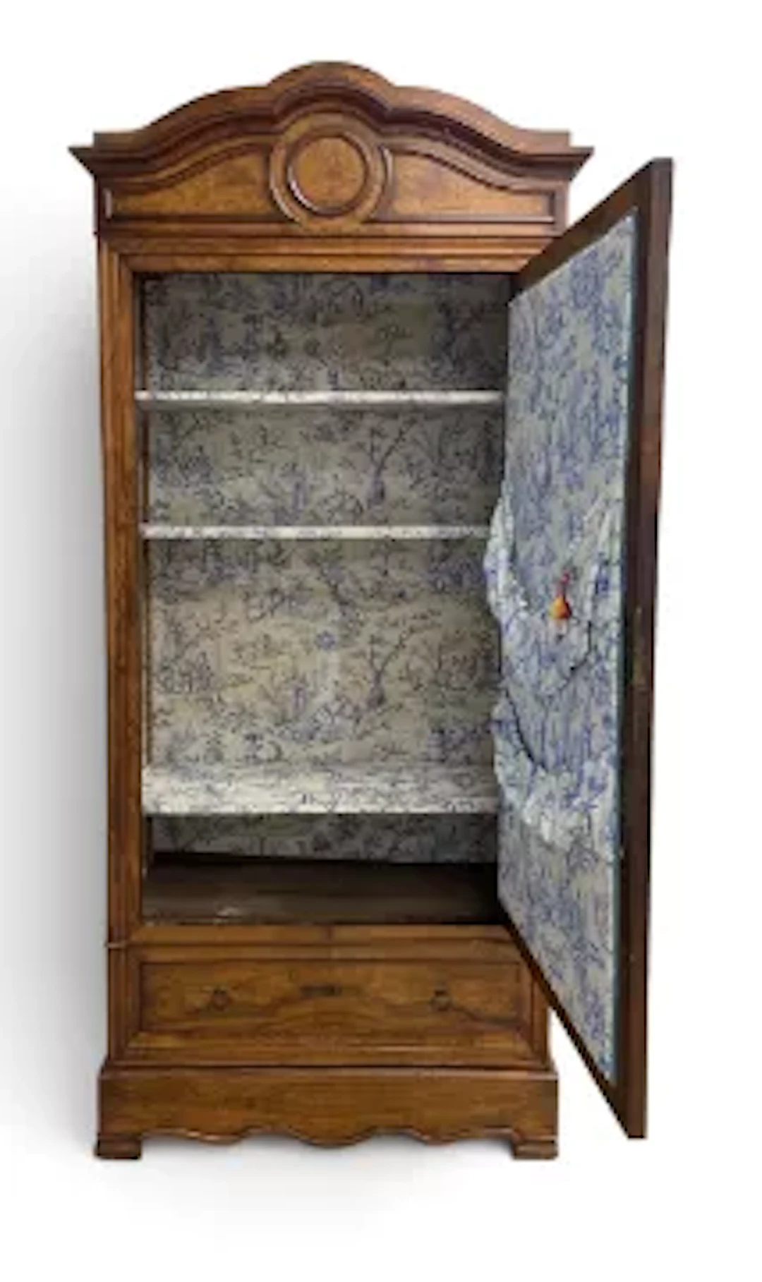 A 19th century French walnut wardrobe, the arched shaped pediment