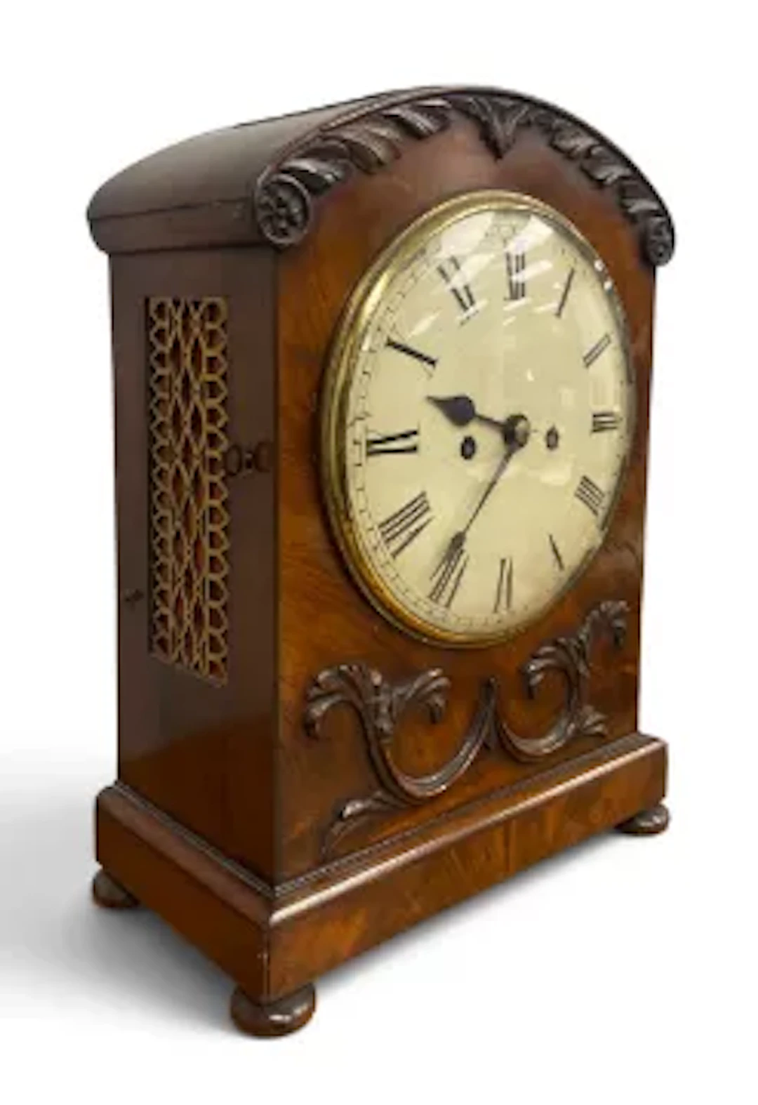 An early 19th century mahogany bracket clock, arched form with decorative