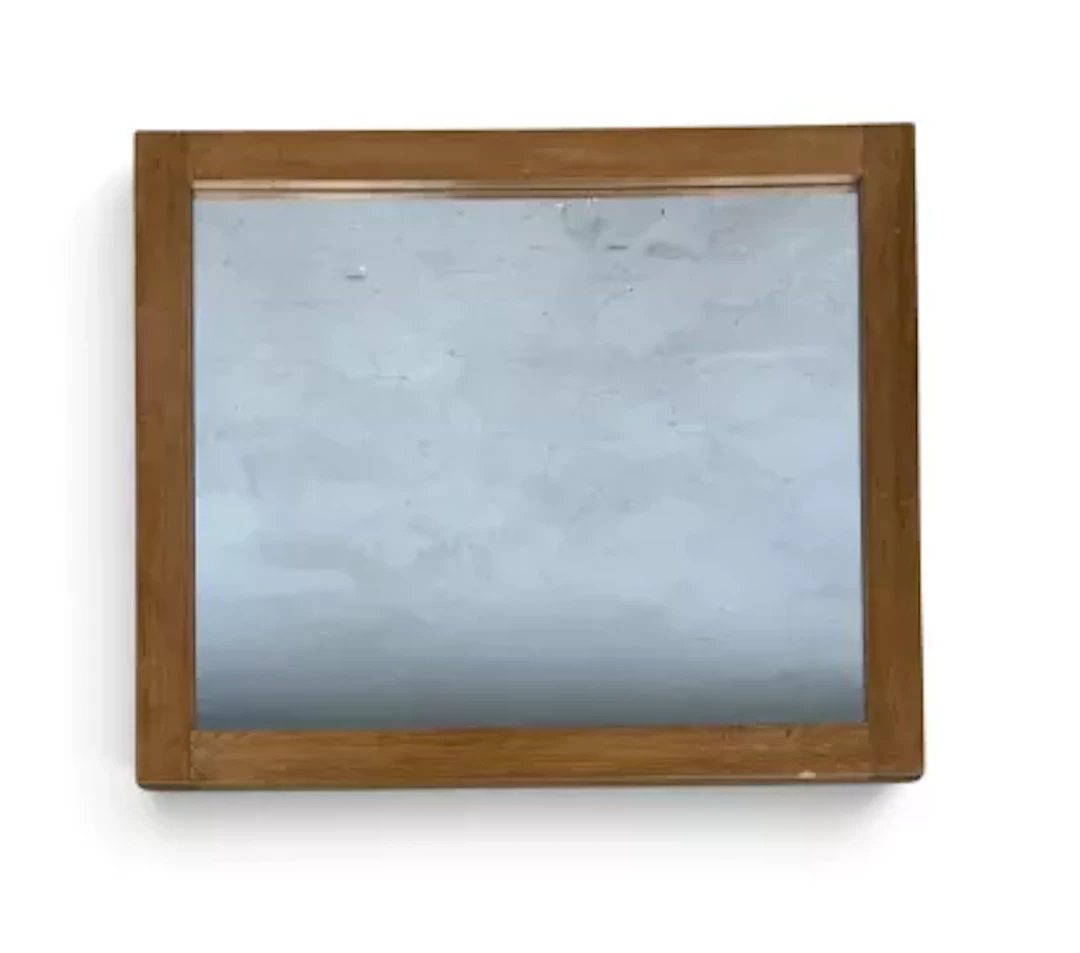A contemporary pine framed mirror. H.60 x W.71cm