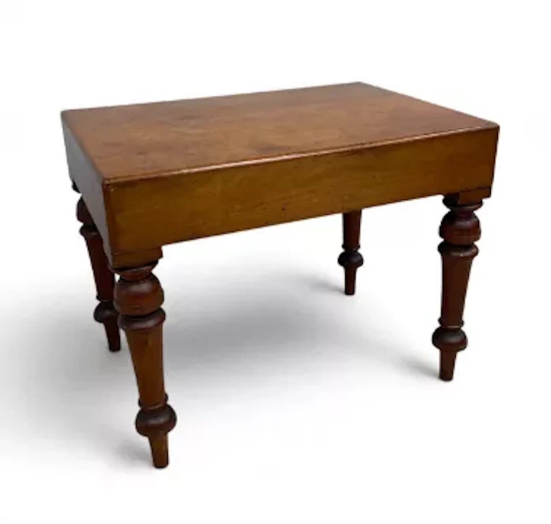 A 19th century mahogany footbath with drop in cover over porcelain