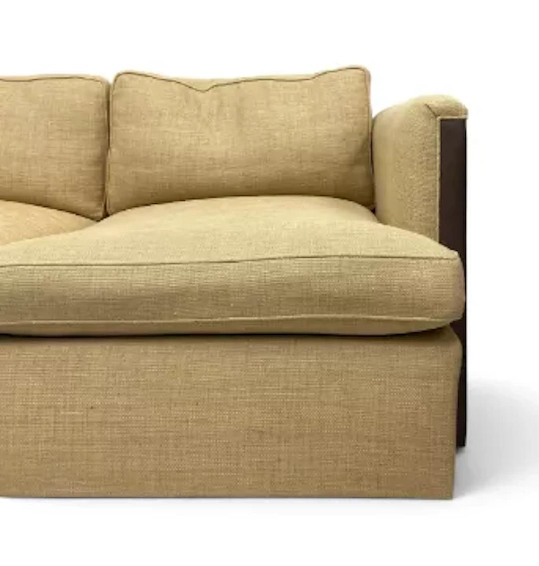 A contemporary khaki hessian upholstered four seater sofa with square