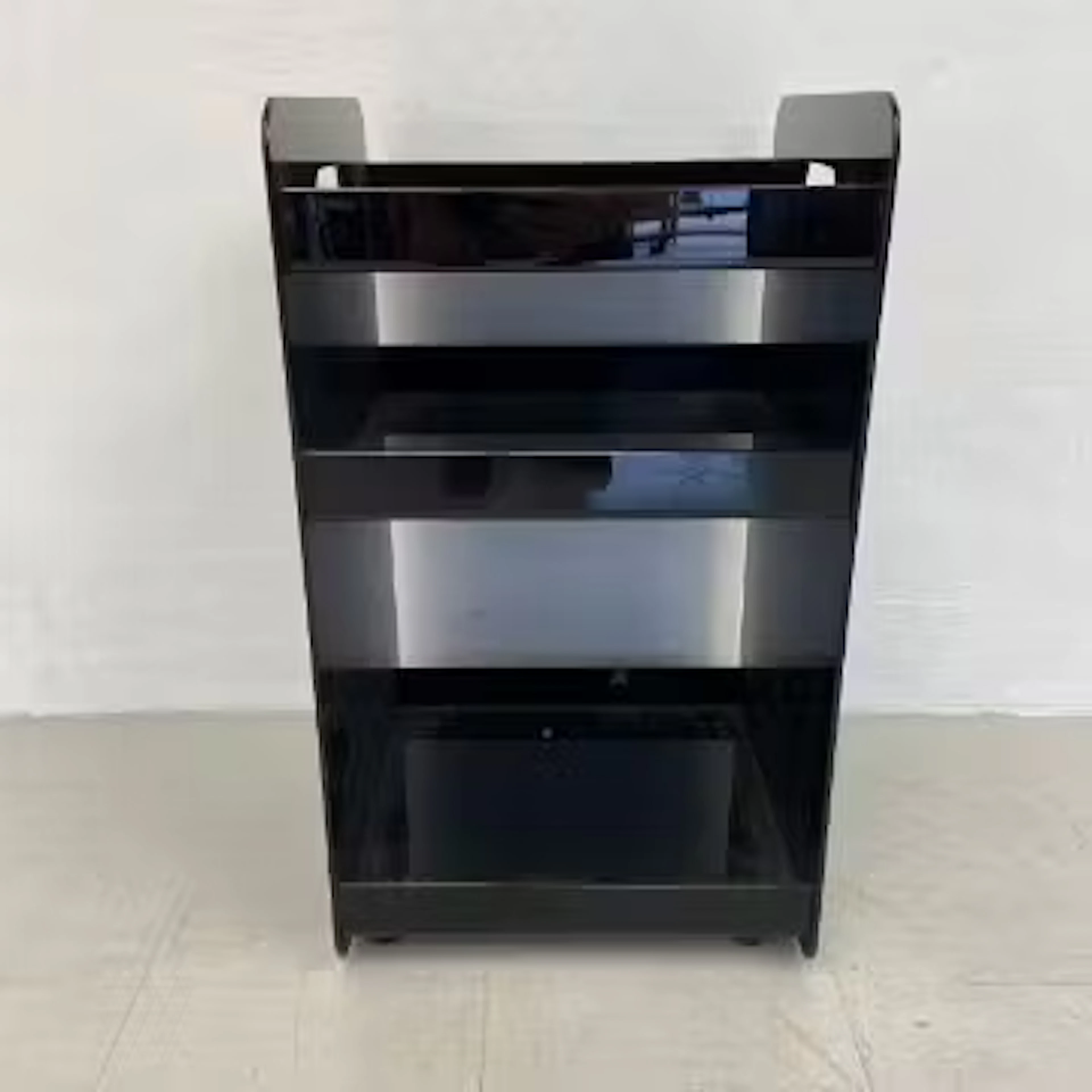 A vintage Habitat style black moulded plastic shelving unit or office