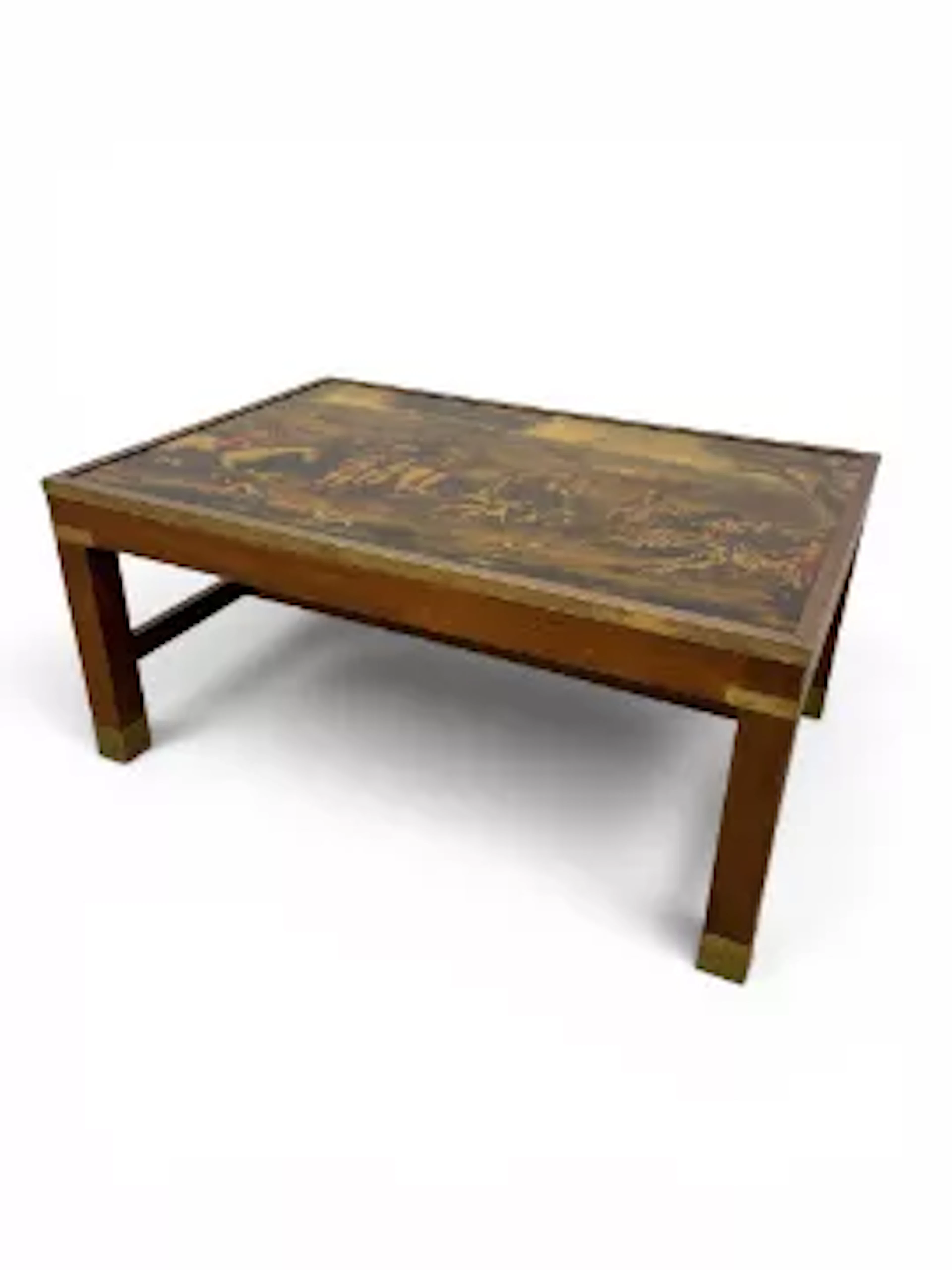 A vintage campaign style brass bound mahogany coffee table with printed